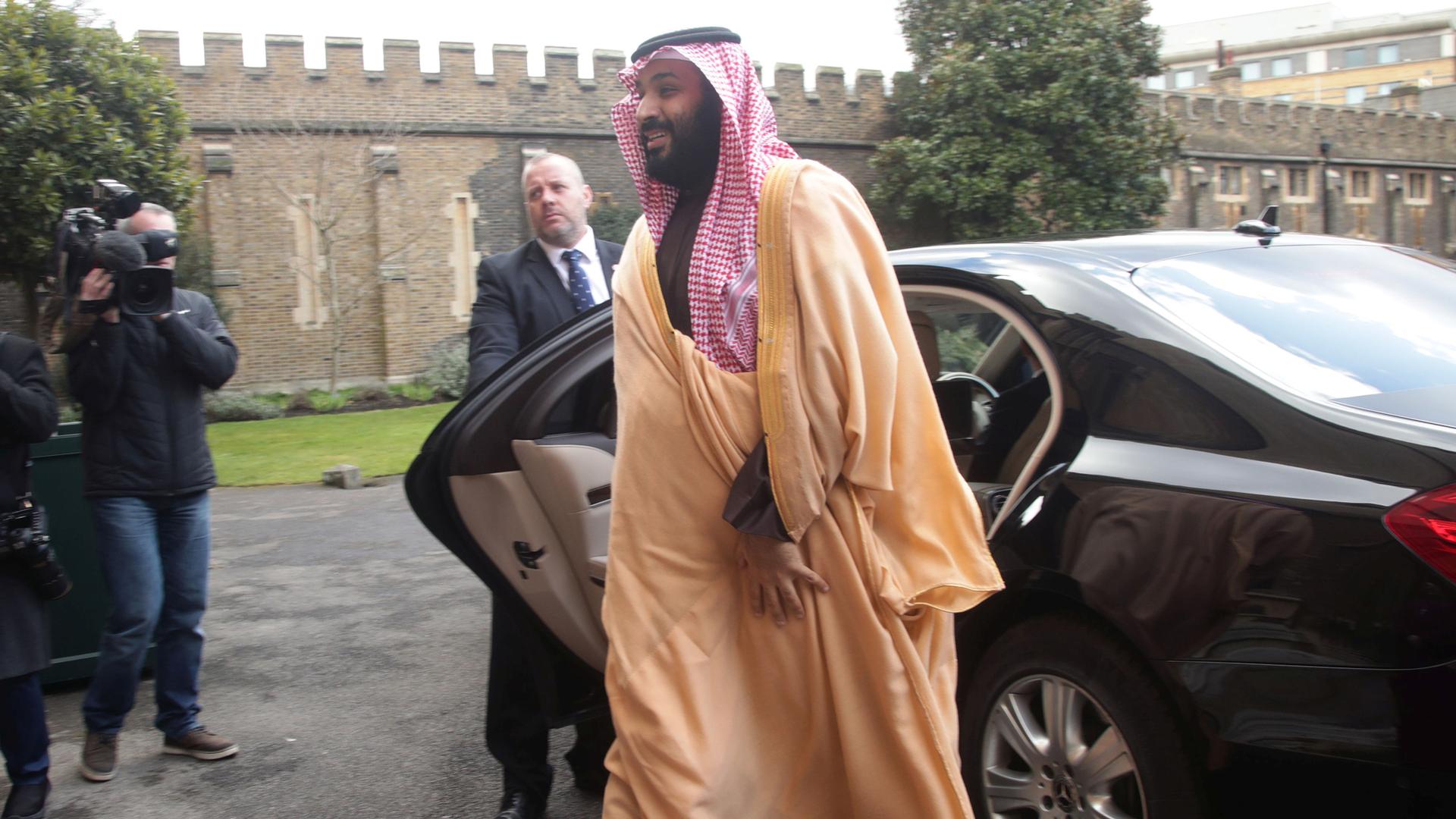 The Crown Prince of Saudi Arabia Mohammed bin Salman walks from a black car toward Lambeth Palace, London.