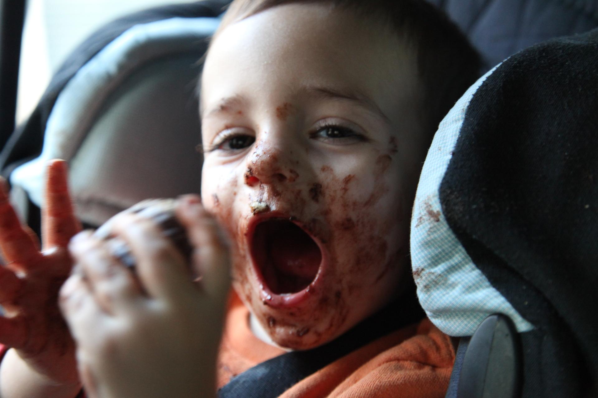 A young boy feasts on chocolate, but rising prices mean he might have to come up with less messy ways to enjoy it.