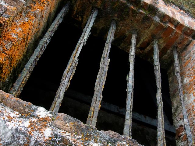 Rusted window bars of a prison in Haiti.