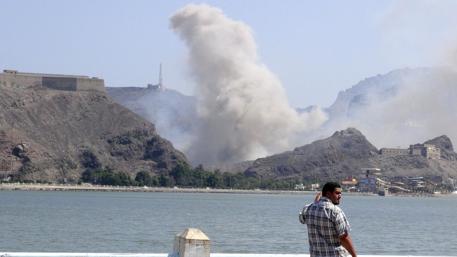 Smoke rises from an arms depot at the Jabal Hadeed military compound in Yemen's southern port city of Aden on March 28, 2015.