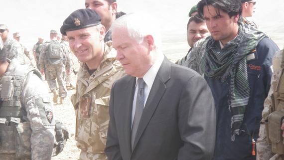 Afghan Ajmal Faqiri, wearing a scarf, served as a translator for former US Secretary of Defense Robert Gates