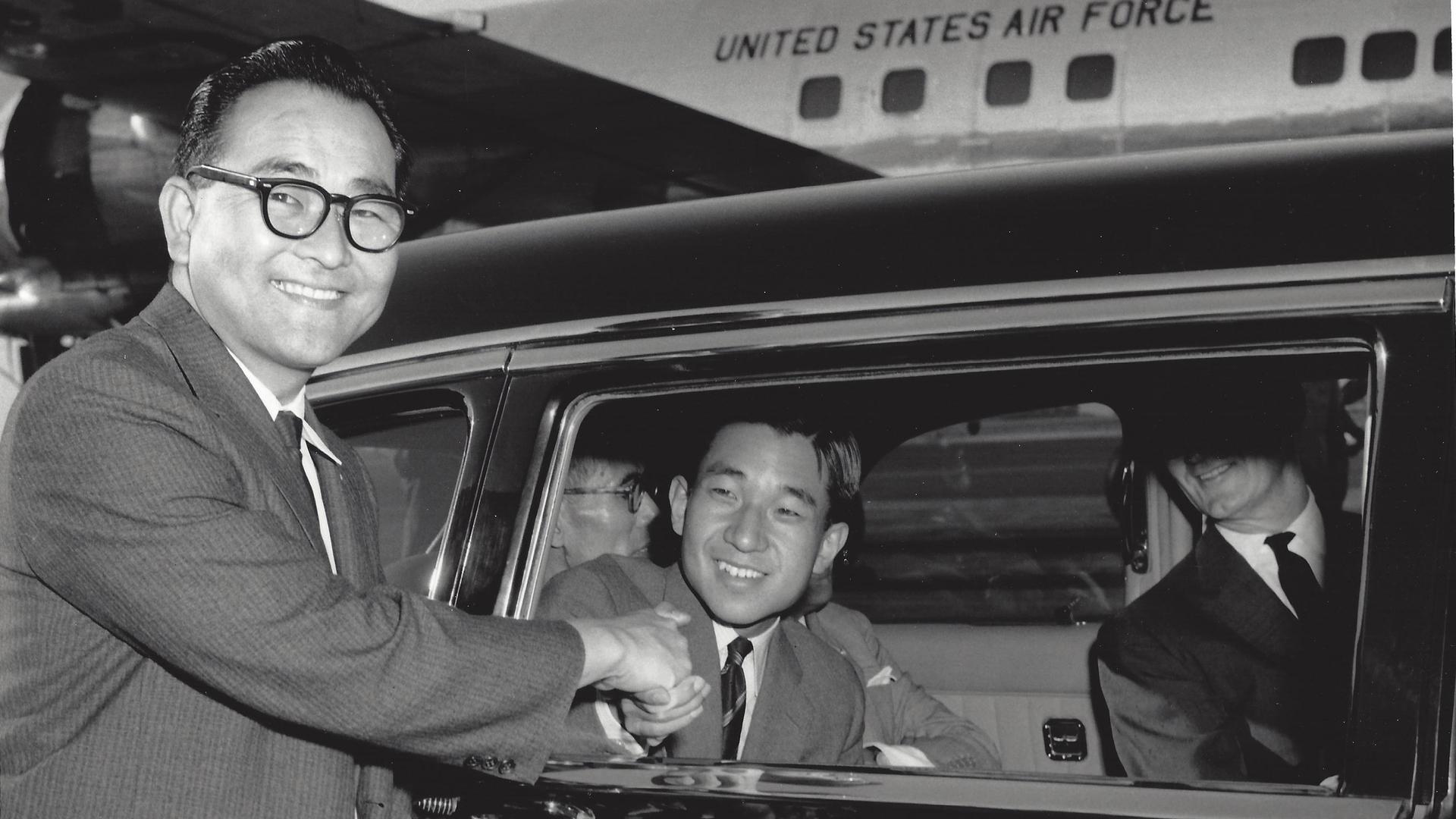Bruce Kaji, shaking the hand of Japan's Crown Prince who had just landed in Los Angeles on a US Air Force airplane, in 1961. "In our family, we call this photo, The Prince and the Pauper.," says Bruce's son, Jon.