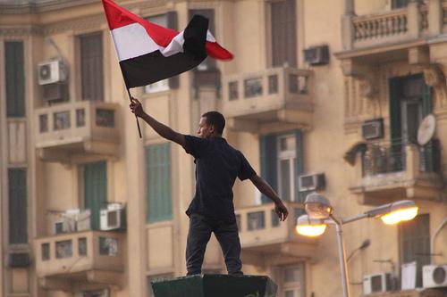 Youth holding Egyptian Flag July 29, 2011