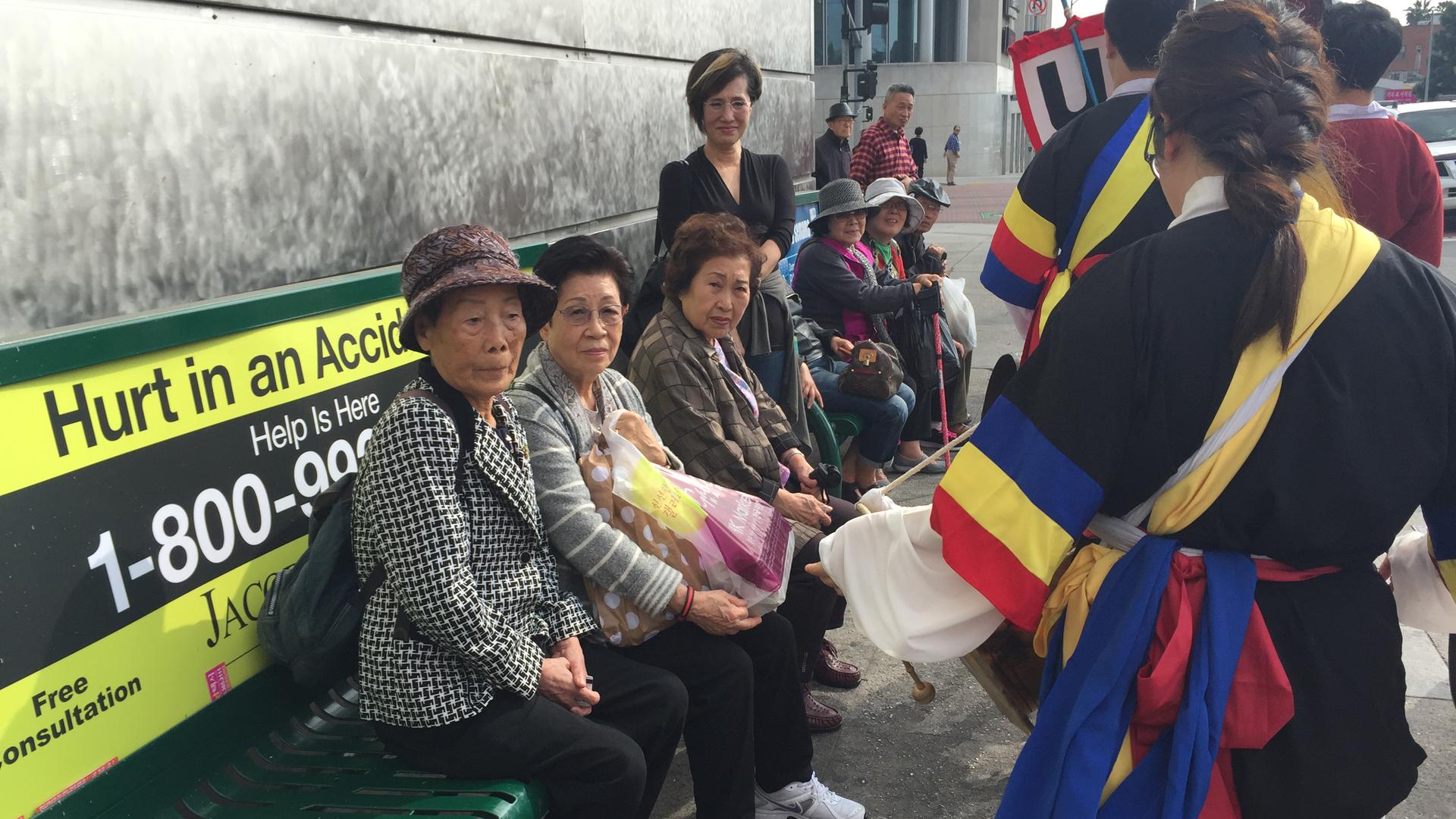 Korean grandmas get a surprise drum line performance while waiting for the bus in LA's Koreatown. The drumming celebration is now popular in Los Angeles, but it wasn't so much when it first started there in the late 1980s.