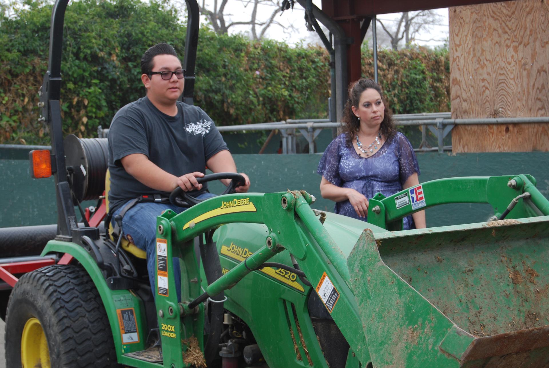 Jessica Fernandes heads the agriculture program at Buena Park High School. Students can learn everything from ag economics to how how to drive a tractor, like sophomore Moses Nathan Talavera.