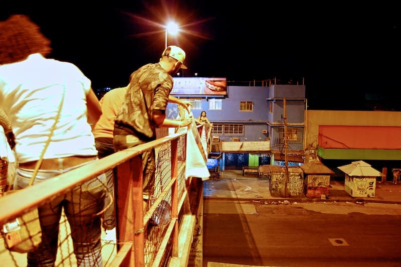 Activists put banner on pedestrian bridge in Rio