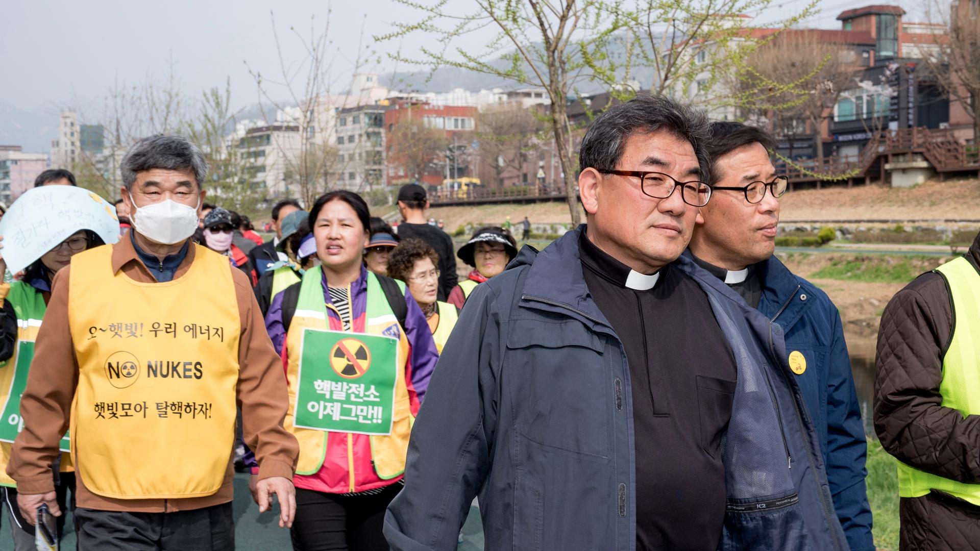 Catholic priests lead a protest march at an anti-nuclear demonstration outside of Seoul in April 2017.