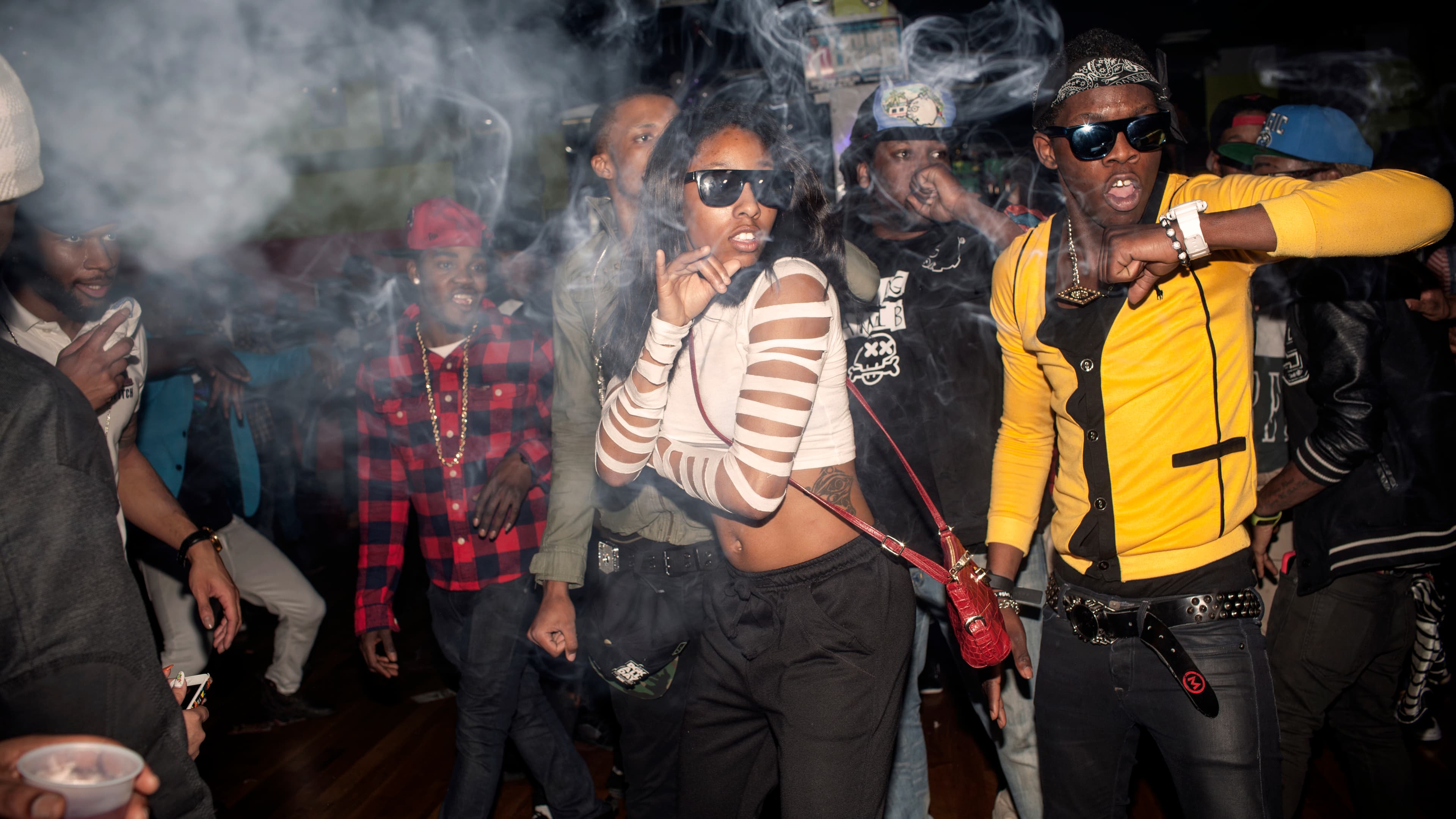The Flavor Essence dance team moves through its choreography in unison as smoke clouds the air in a nightclub around 3am on a Thursday night. Videographers often attend the parties to make video of the dancers, which will be published on the internet on v