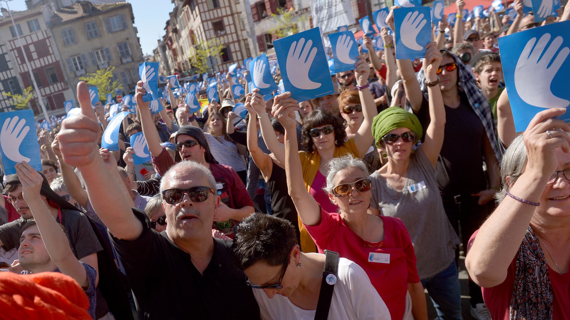 Basque pro independence politician Juan Mari Olano gives a thumbs-up while attending a rally following the announcement of disarmament by armed separatists ETA in Bayonne, France.