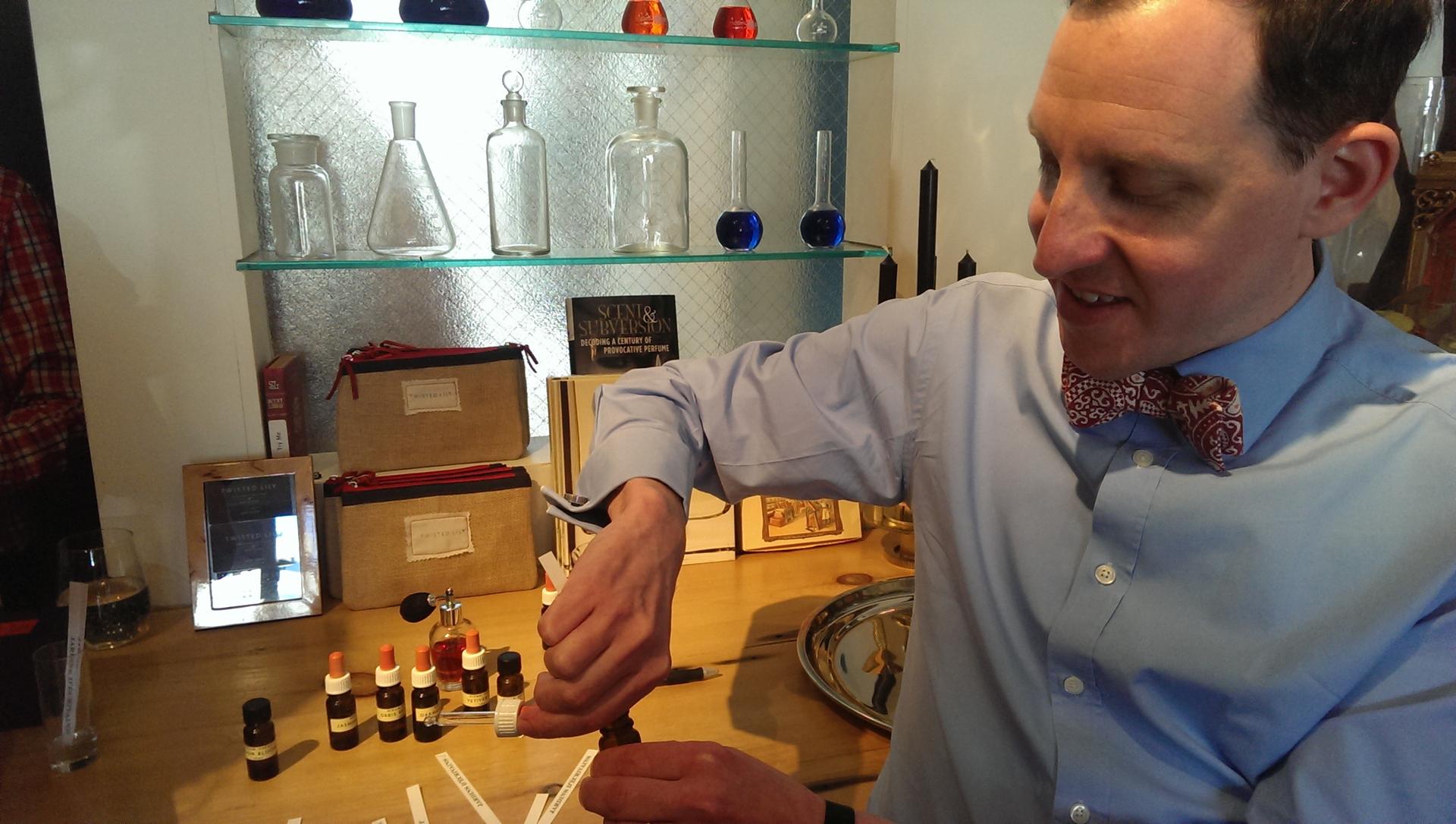 Hiram Green shows off some of the raw essences that go into his perfumes. He's at Twisted Lily, a fragrance boutique in Brooklyn.