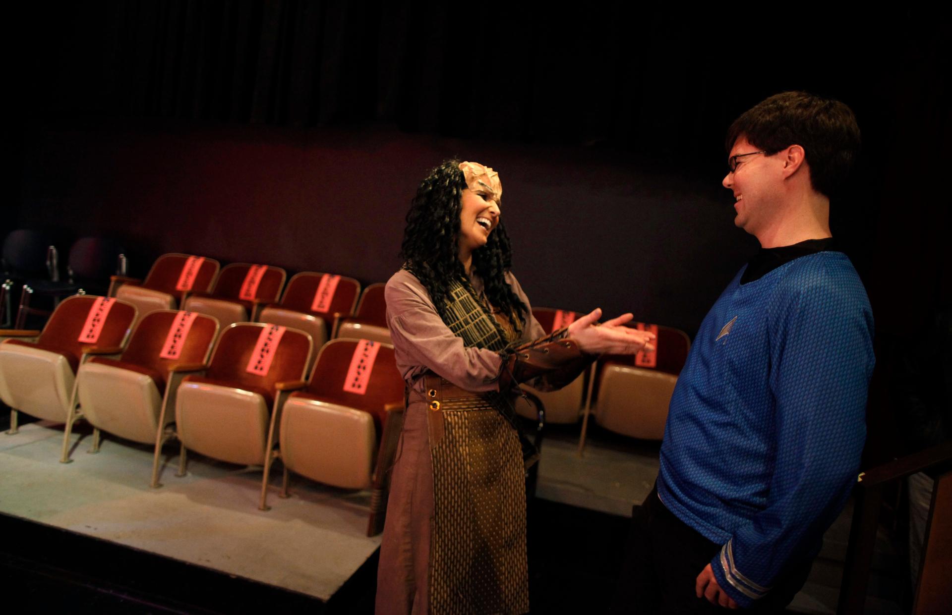 Performer Jacqueline Salamack (L) jokes with an audience member after a performance of "A Klingon Christmas Carol" in Chicago, December 20, 2012.