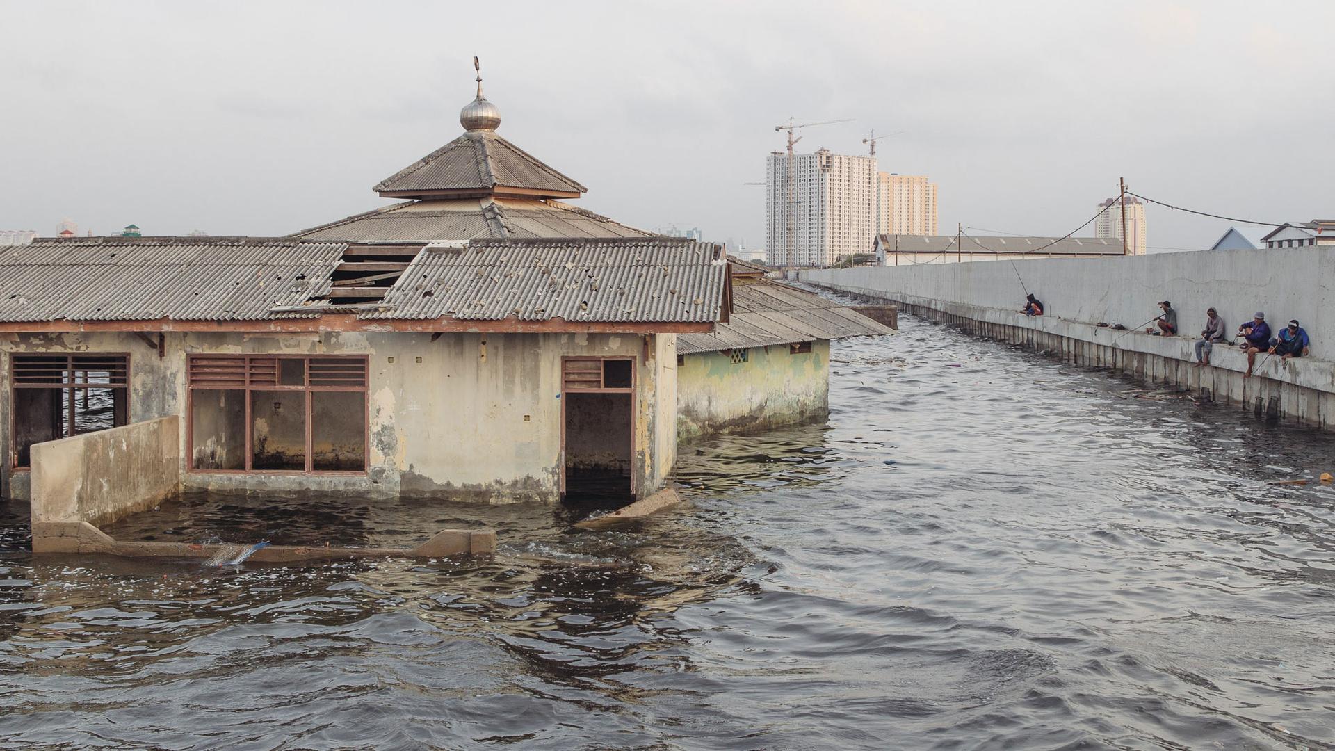 An abandoned mosque outside the seawall in Muara Baru, Jakarta. The city is sinking as a result of massive groundwater extraction, and the problem is especially bad in Muara Barus, which is already below sea level.
