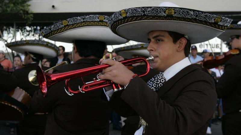 A mariachi plays a red trumpet during the International Mariachi Parade in Guadalajara September 2, 2012.