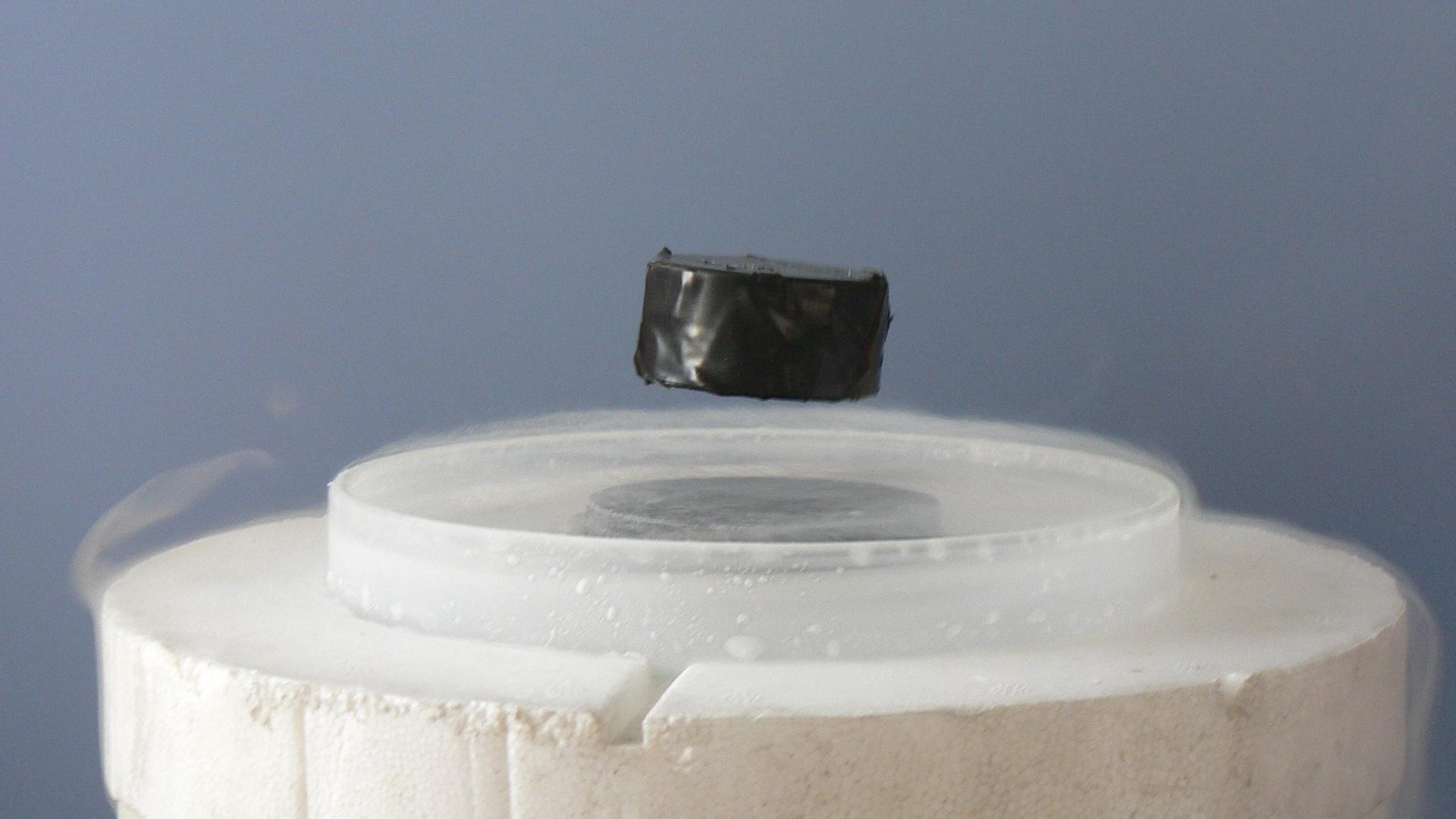 A magnet levitating above a superconductor.