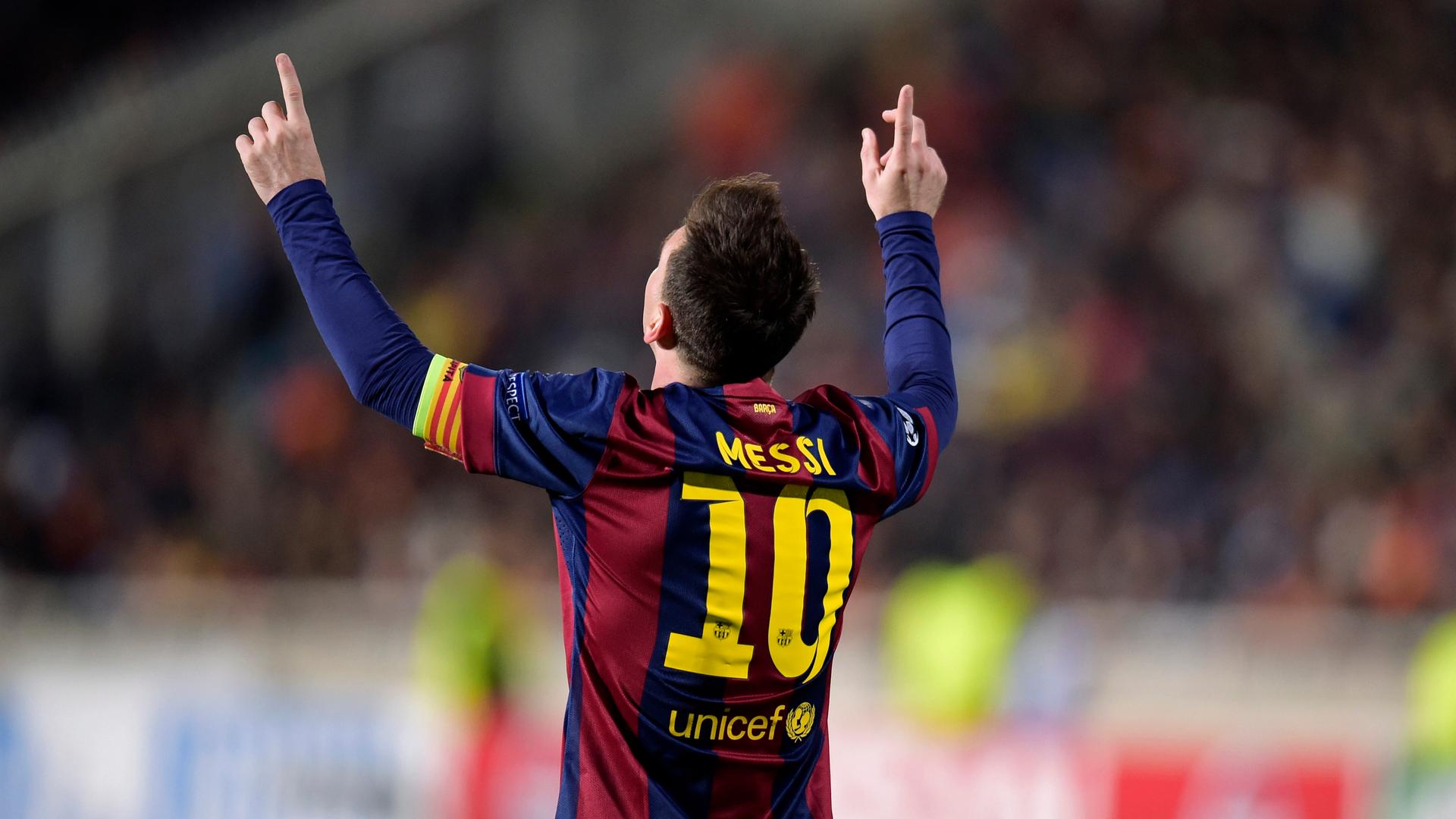 Barcelona's Lionel Messi celebrates after scoring a goal against APOEL Nicosia during their Champions League Group F soccer match in Nicosia November 25, 2014.