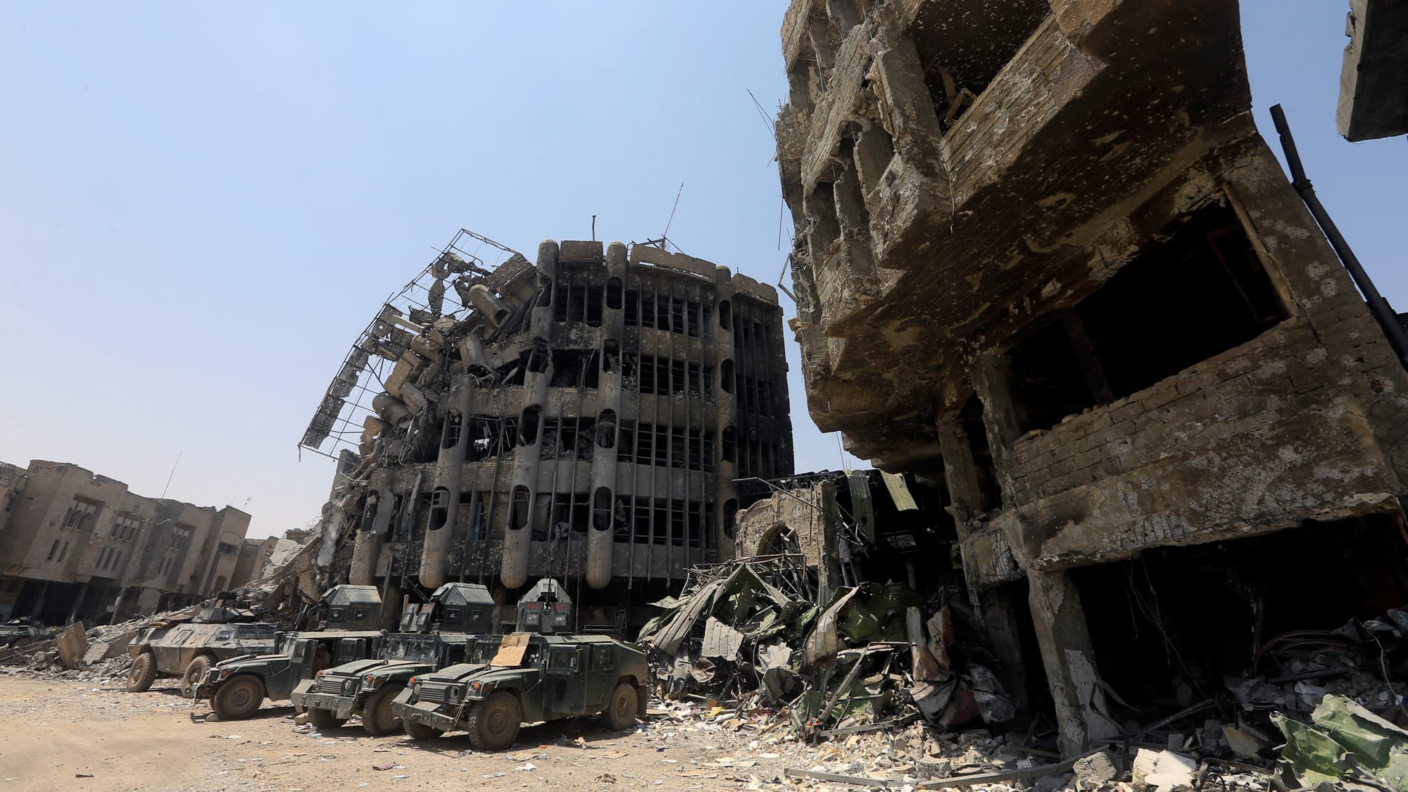 Military vehicles of Iraqi security forces are seen in Mosul's Old City.