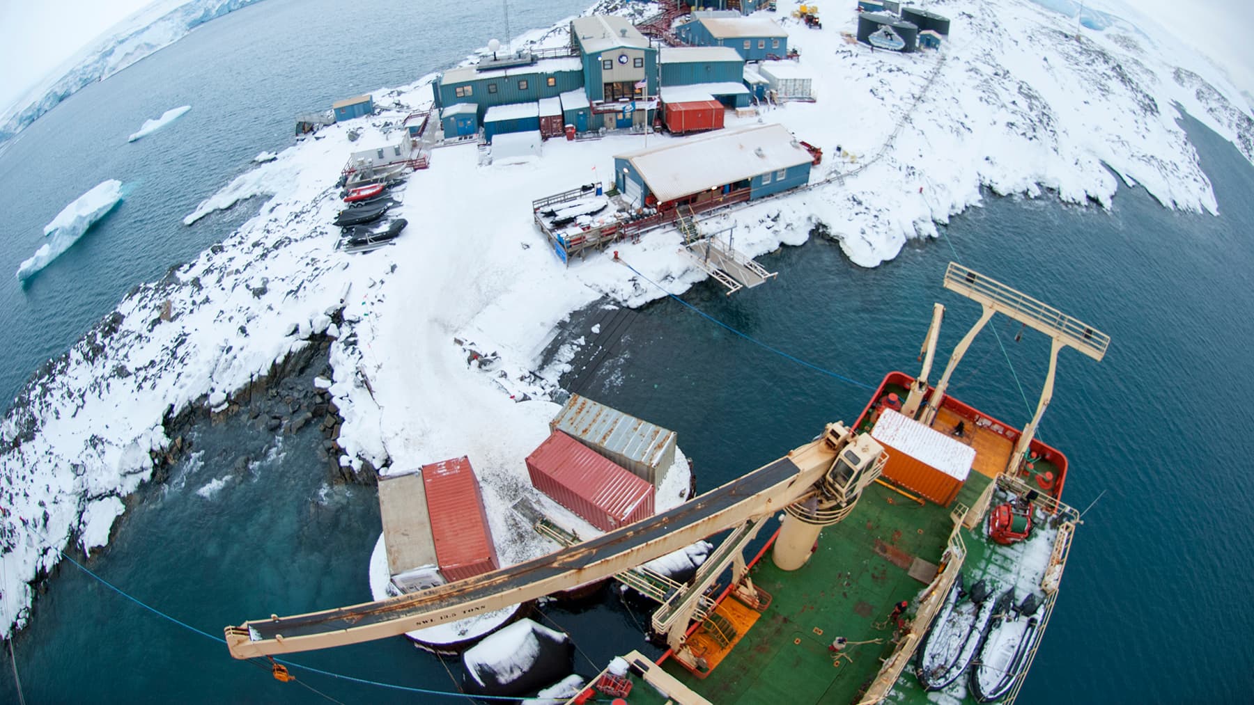 A view of Palmer Station and its supply ship, the Laurence M. Gould, from the science mast.