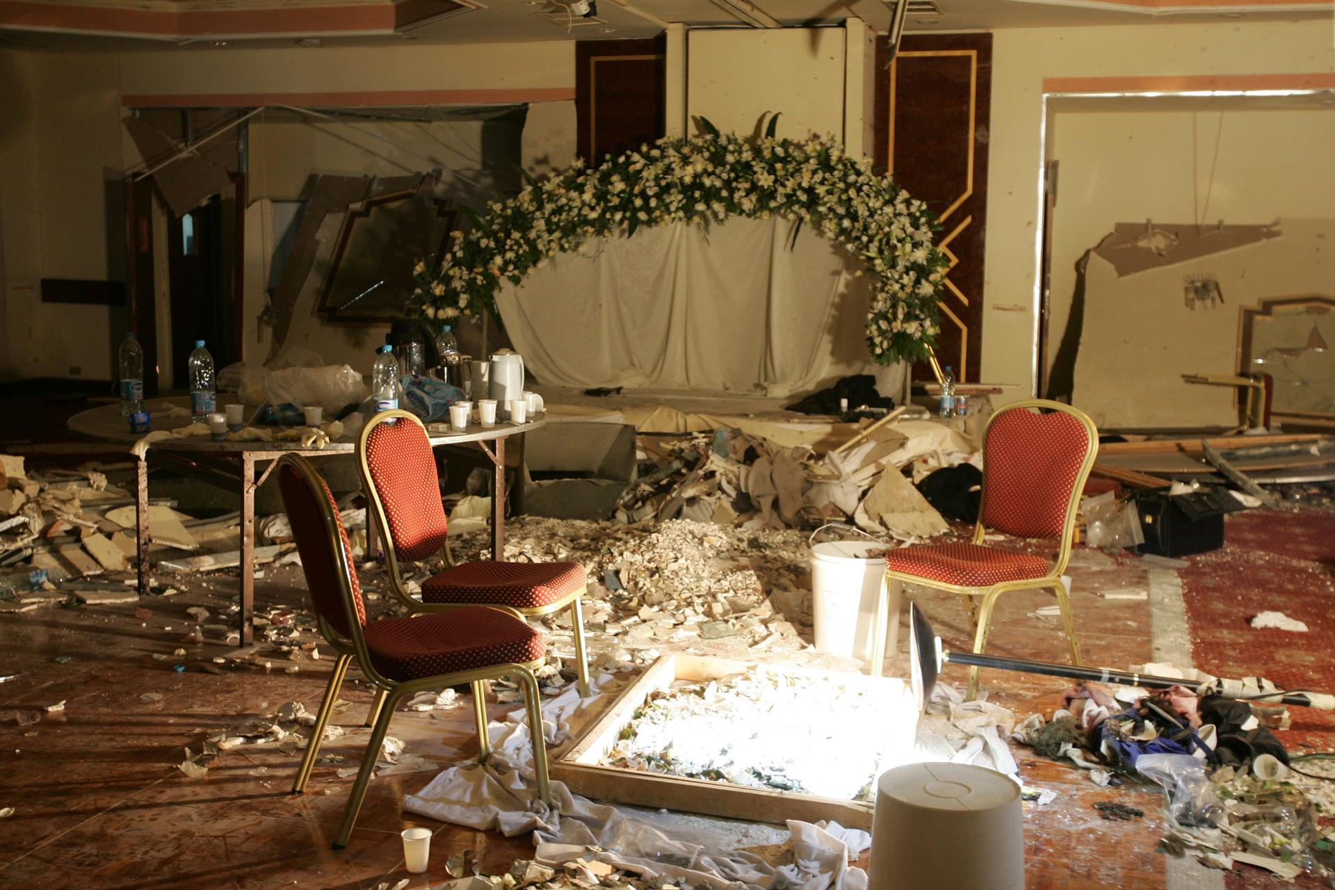 Debris lays strewn on the floor of a room being used by a wedding party following a bomb blast in the Radisson SAS hotel in Amman, November 10, 2005.