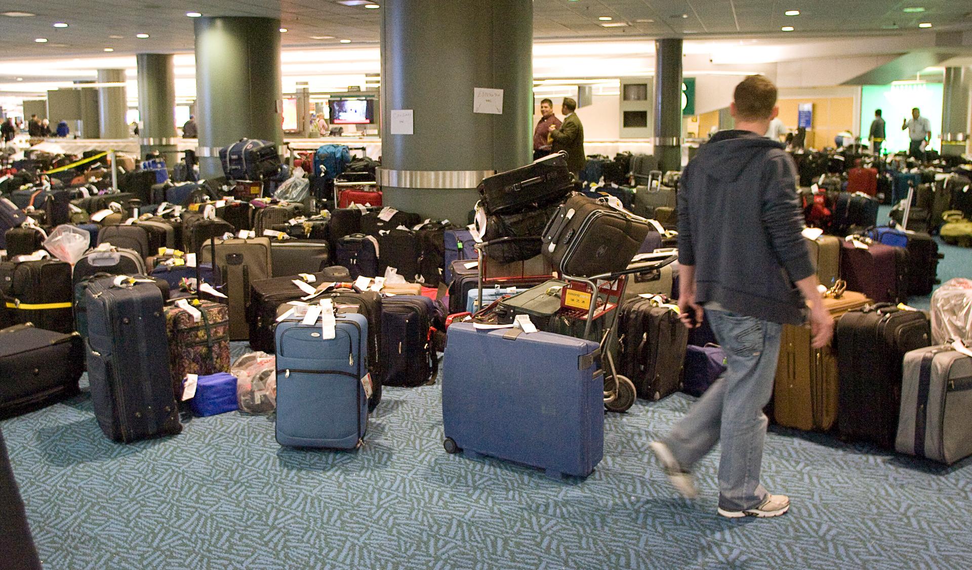 A passenger looks for his displaced or lost luggage at the international airport in Vancouver, British Columbia.