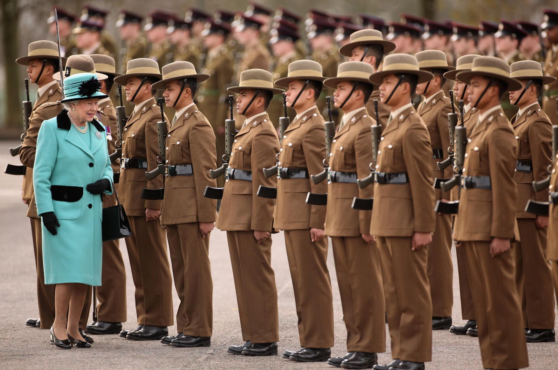 Britain's Queen Elizabeth inspects some of her Gurkha soldiers, in southern England, 2011.