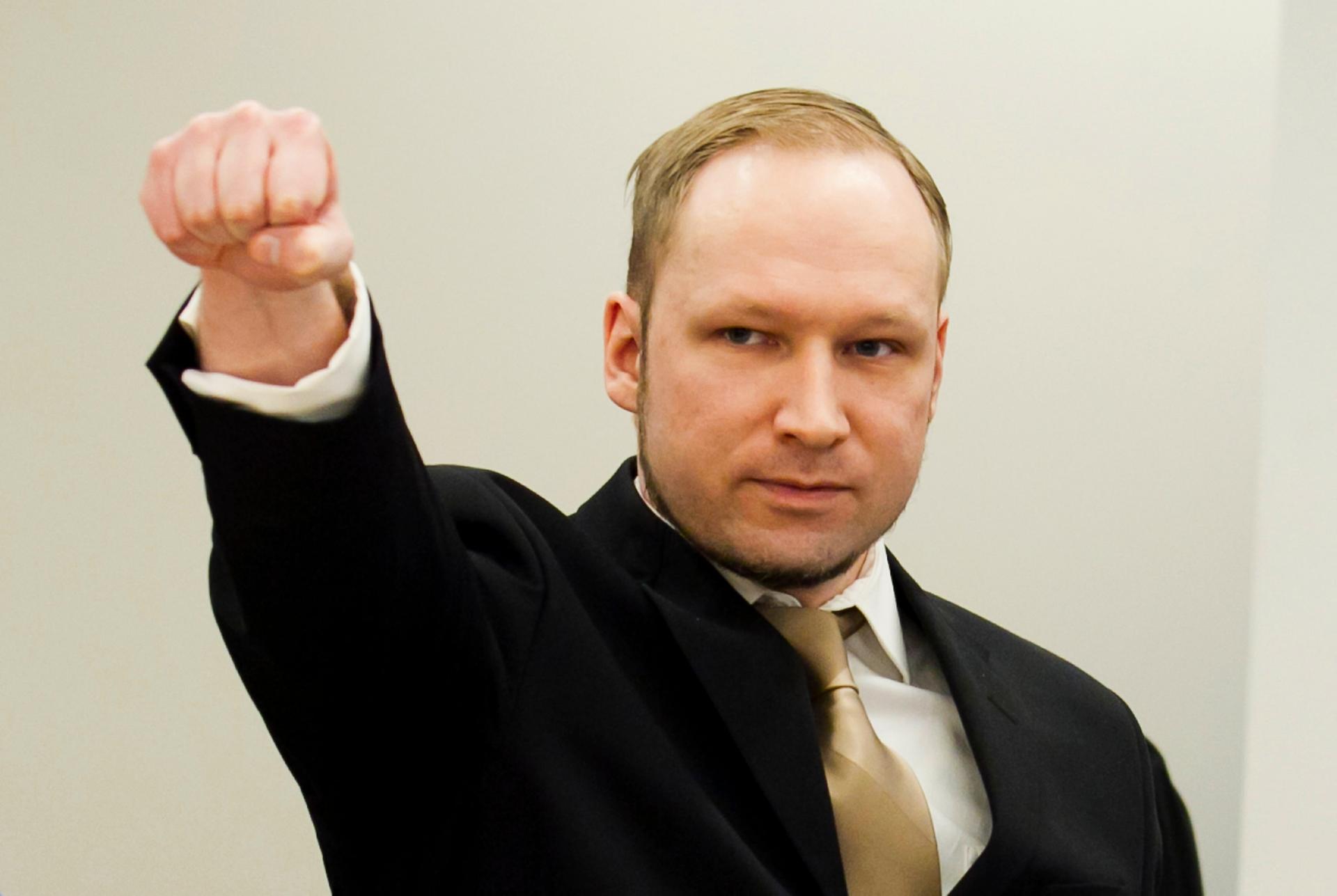 Norwegian mass killer Anders Behring Breivik gestures as he arrives for his terrorism and murder trial in a courtroom in Oslo April 16, 2012.