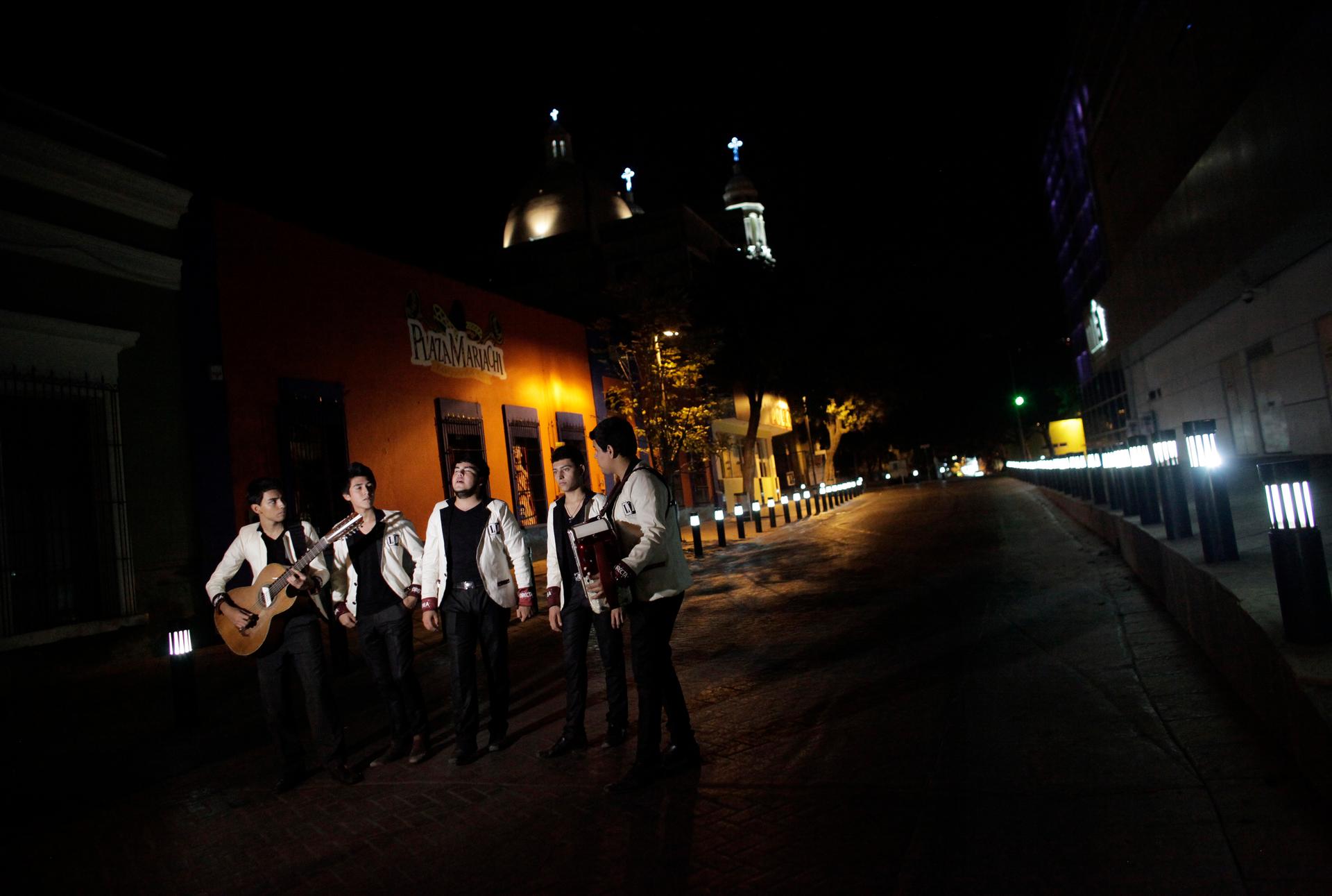 Members of a band record a narcocorrido in downtown Culiacan, Mexico.