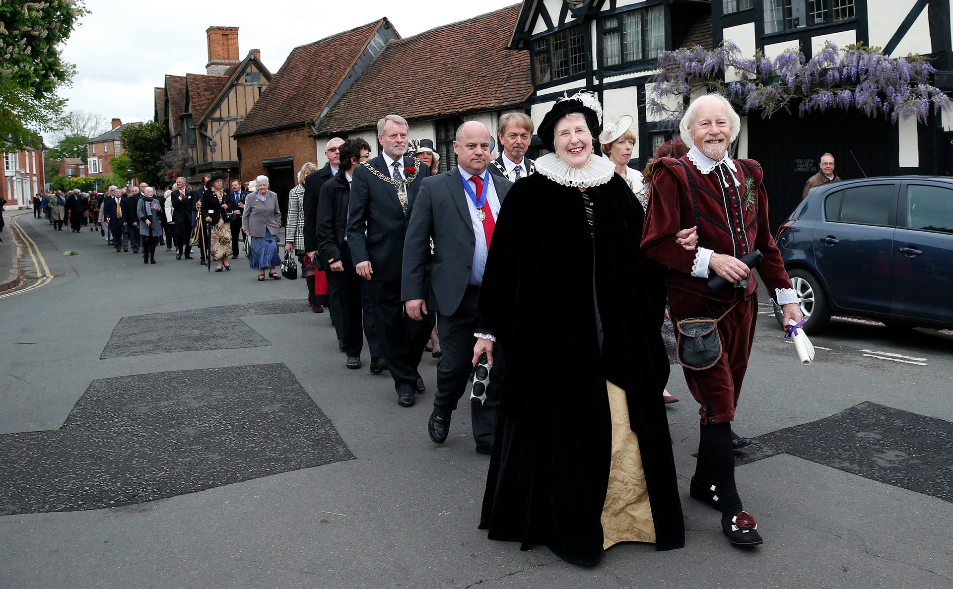 Dressed as William Shakespeare and his wife Anne Hathaway, John and his wife Monica Evans join a procession to Holy Trinity Church where Shakespeare was buried, marking the 450th anniversary of his birth in 2014