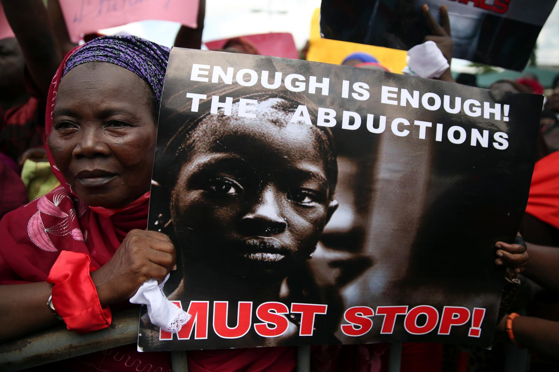 A woman holds a sign during a protest demanding the release of abducted school girls from the remote village of Chibok in northeast Nigeria.