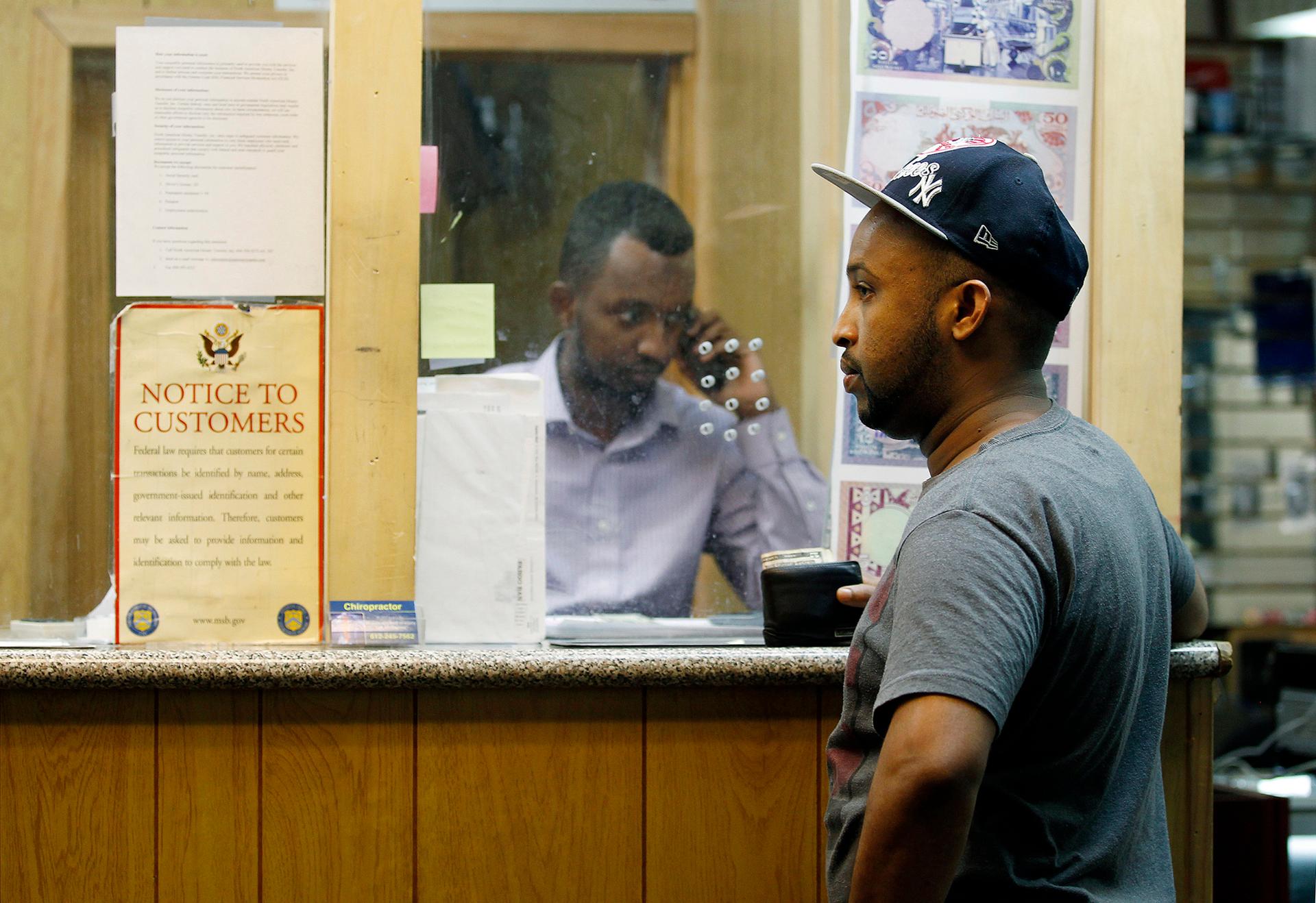 Mohammed Ahamed waits at a money-transfer business in Minneapolis to send money to his ex-wife in Somalia. About 40 percent of all Somali families rely on remittances from another country.