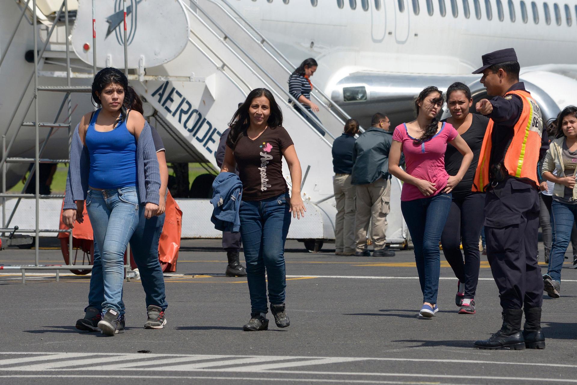 Deportees arrive at the Monsignor Romero international airport in San Salvador.