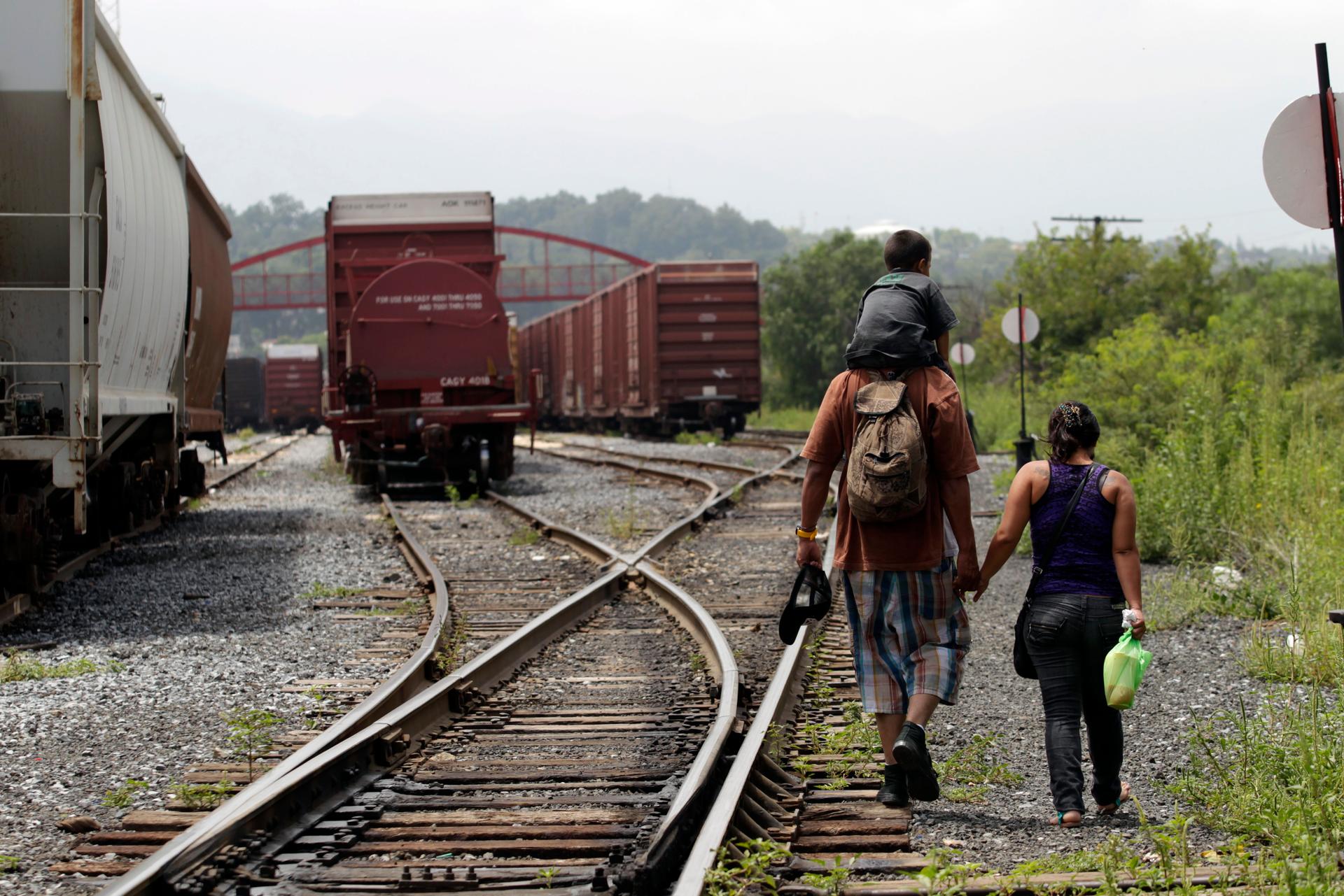 Migrant family crossing US-Mexico border on train