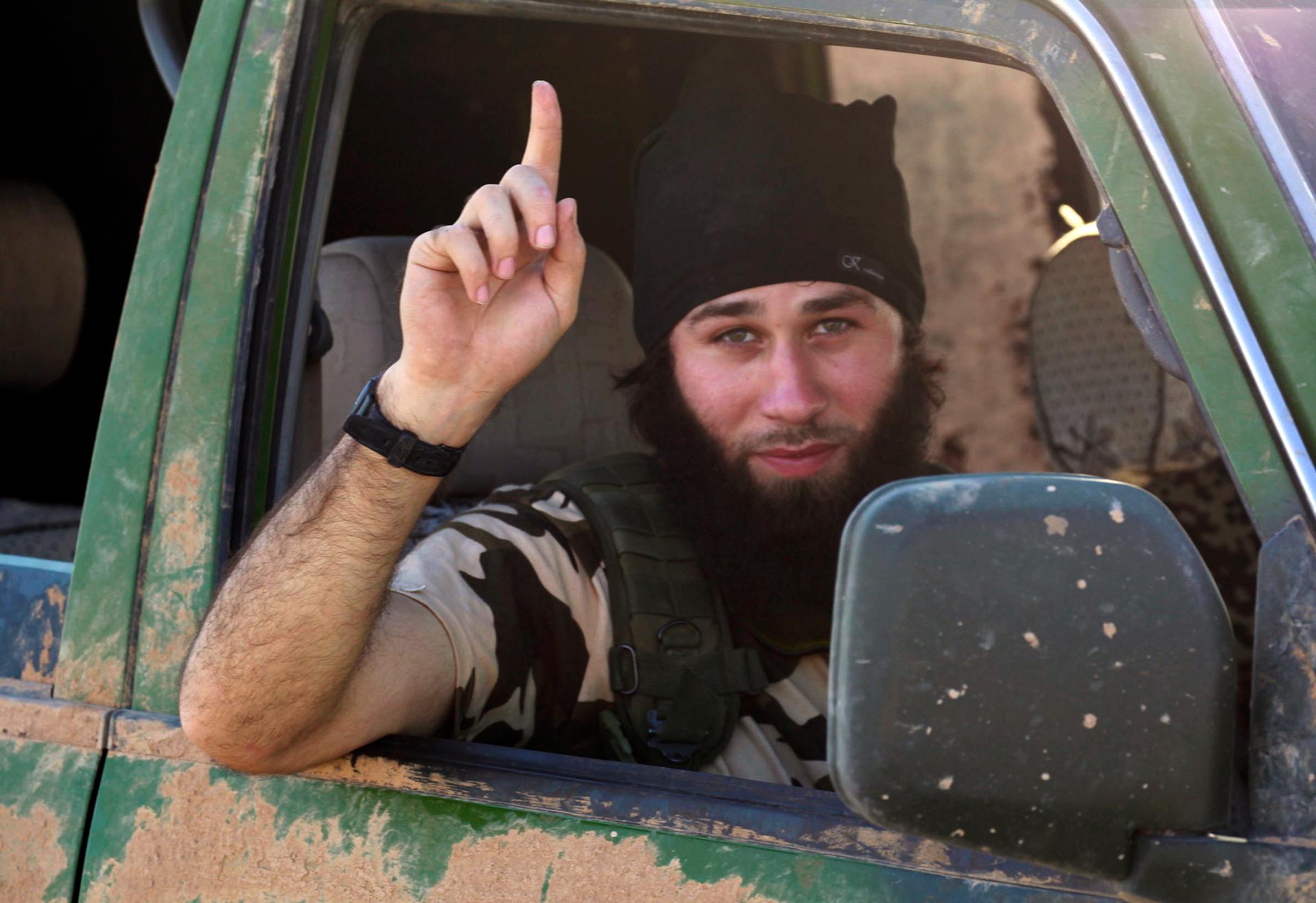 An Islamic State fighter gestures from a vehicle in the countryside of the Syrian Kurdish town of Kobani, after the Islamic State fighters took control of the area in October.
