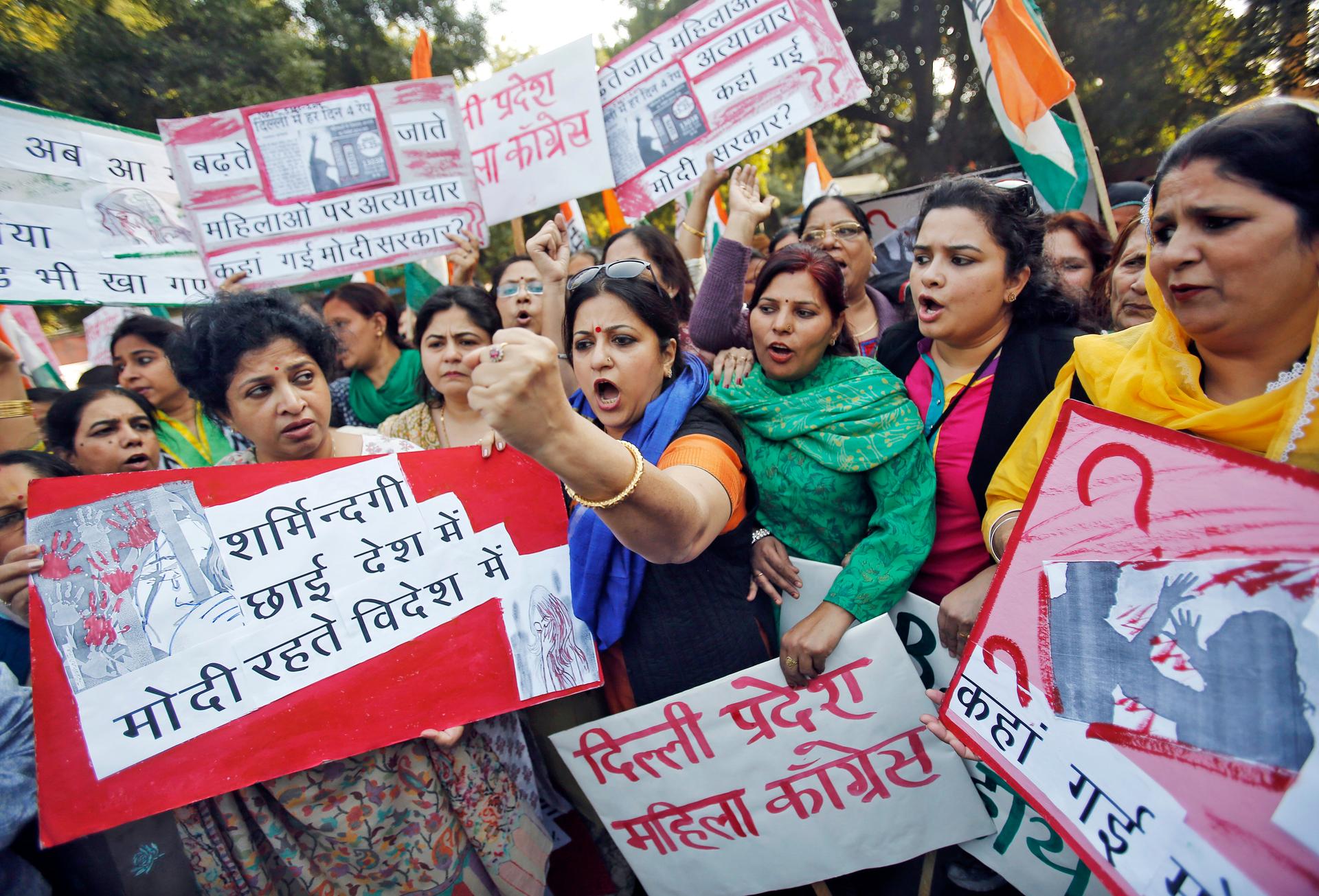 Members of the All India Mahila Congress, the women's wing of the Congress {arty, carry placards that read, "The country is covered in shame..."  The women were protesting the rape of a female passenger by an Uber taxi driver in New Delhi.