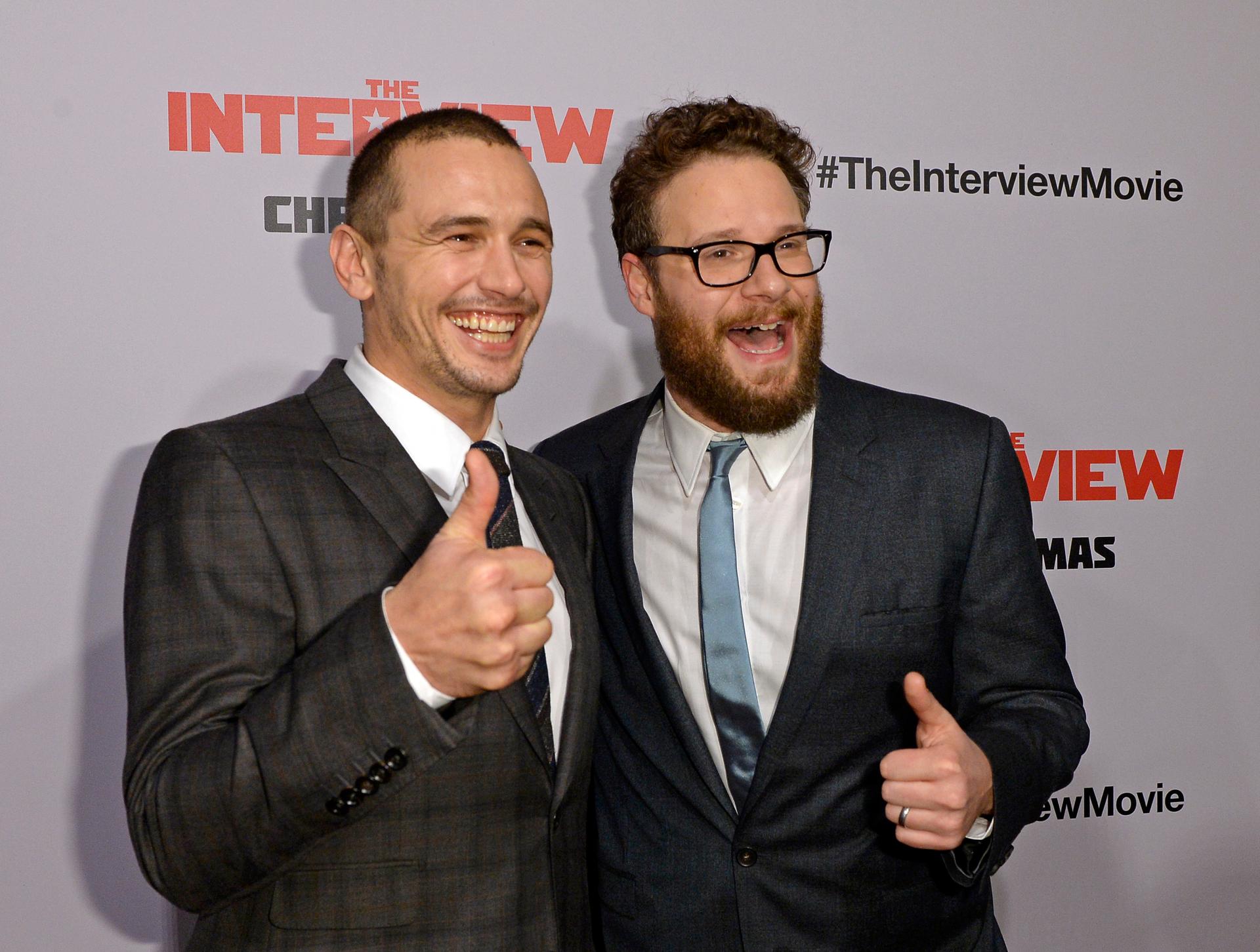 James Franco and Seth Rogen pose during the premiere of the film "The Interview" in Los Angeles on December 11, 2014.