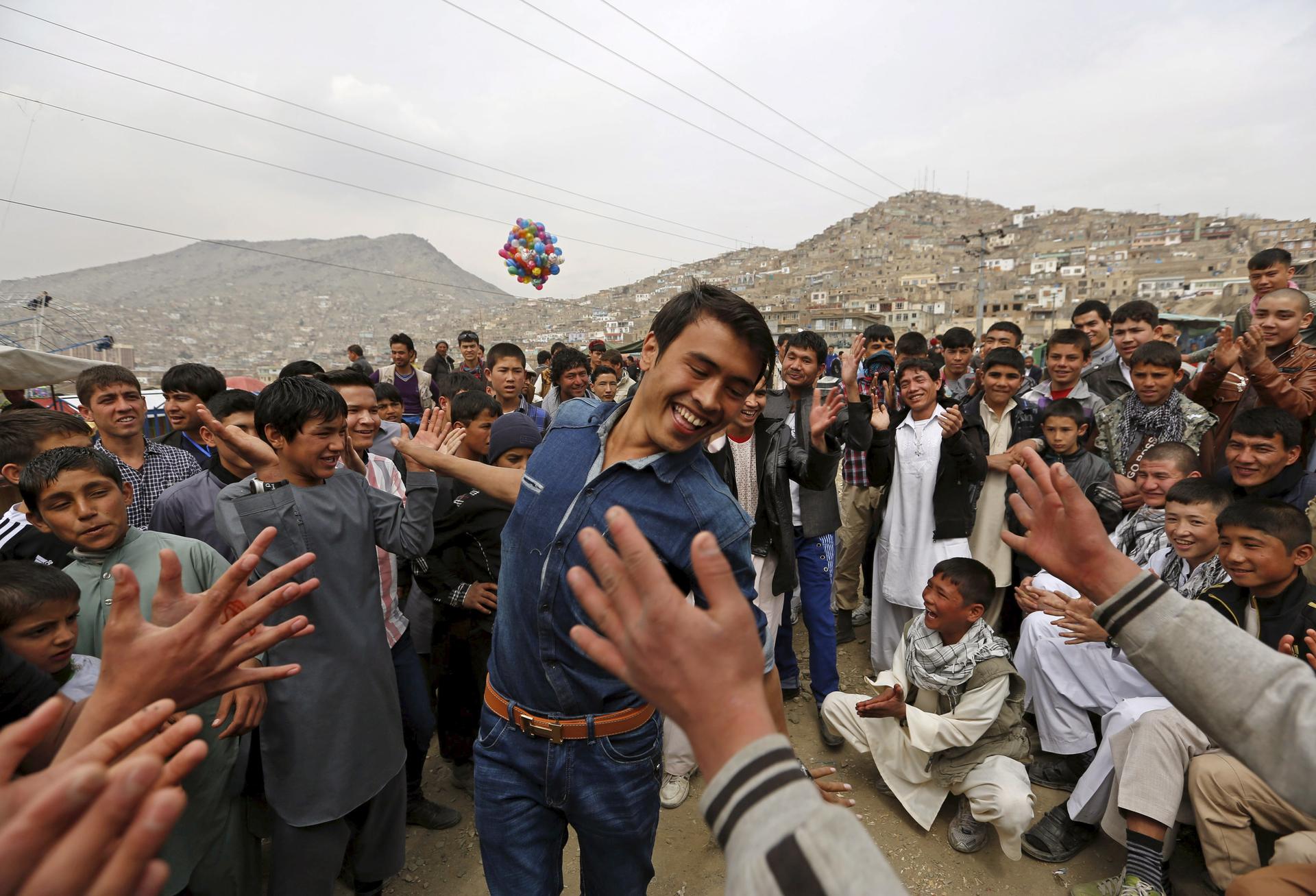A man dances during celebrations for Afghan New Year, or Newroz, in Kabul on March 21, 2015.