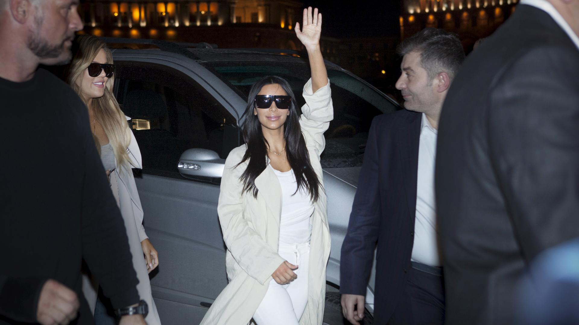 TV celebrity Kim Kardashian gestures on her way to a hotel shortly after arriving in Yerevan, Armenia, on April 8, 2015.