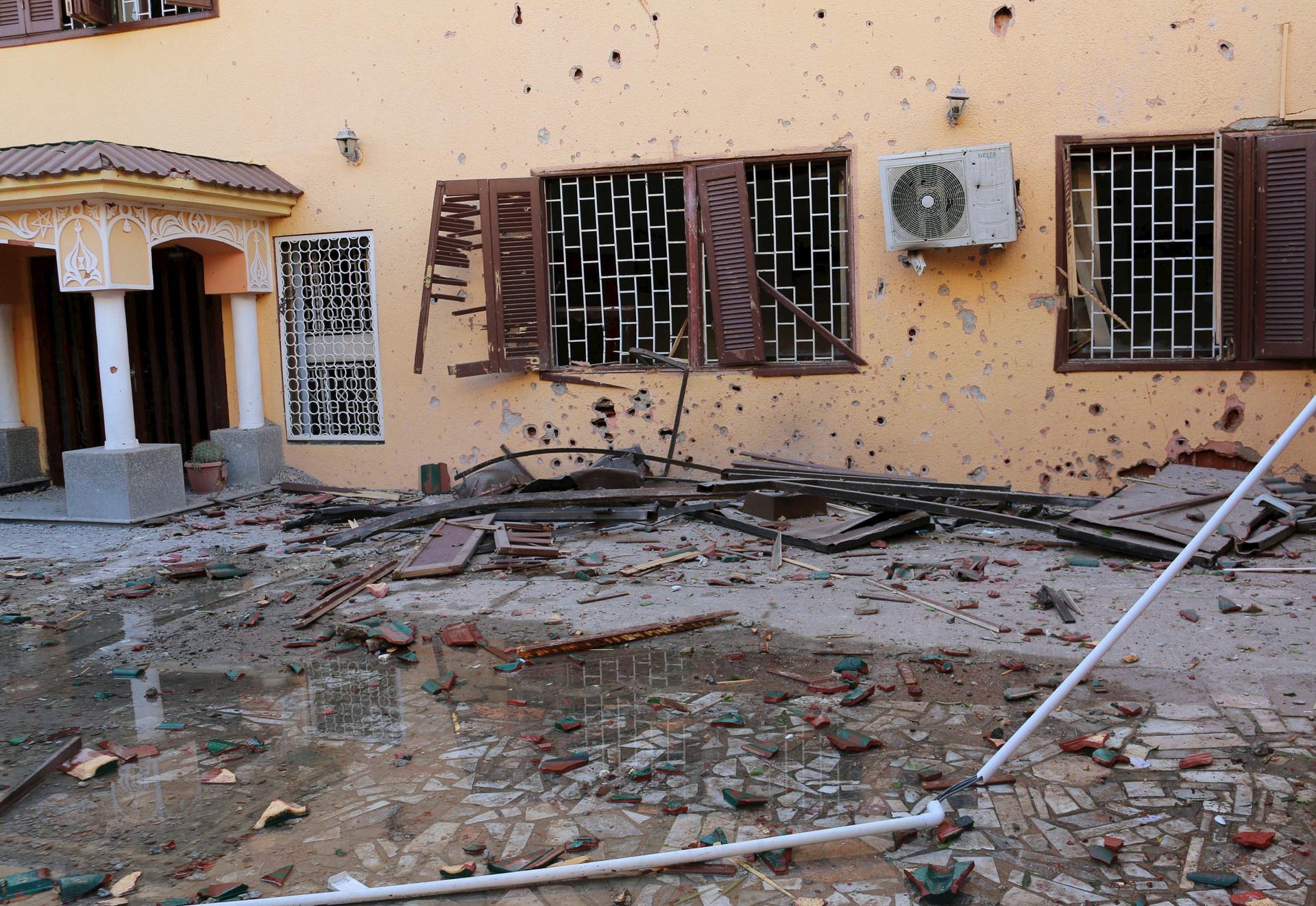 A view of damage after a bomb exploded at the gate of the Moroccan embassy in Tripoli on April 13, 2015.
