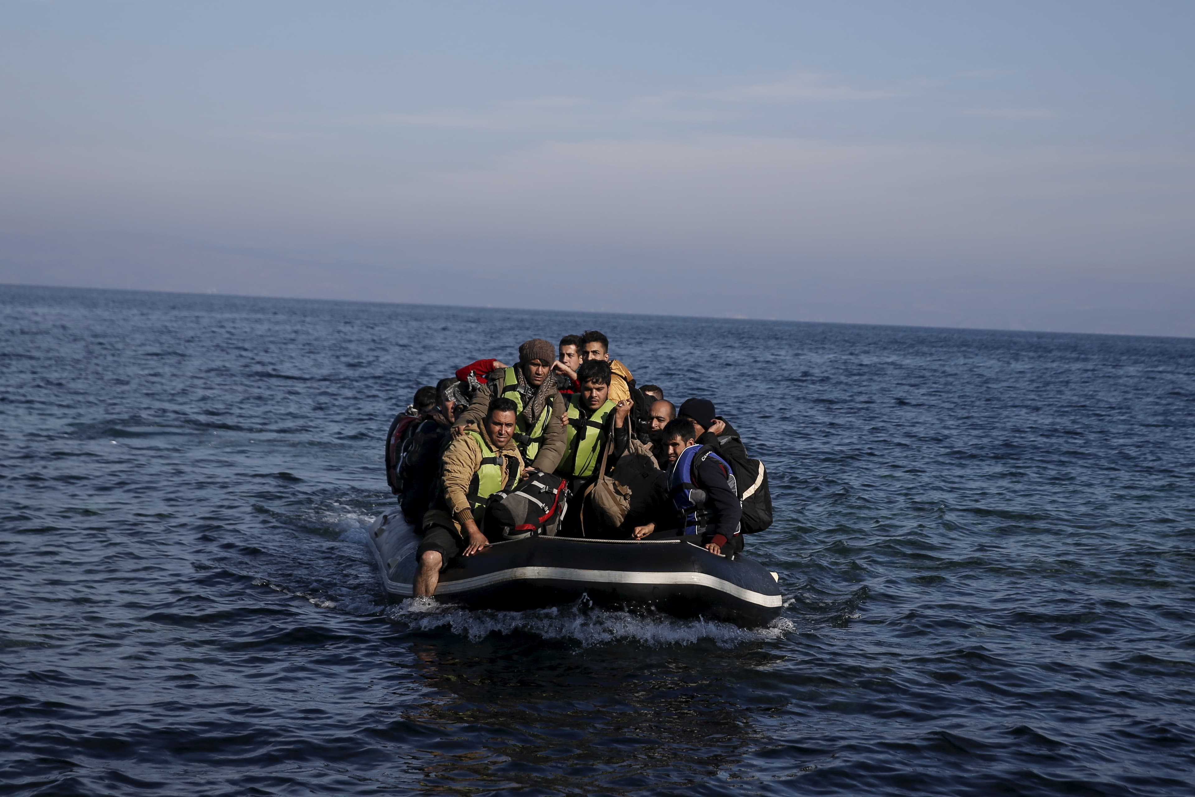 Refugees and migrants arrive on an inflatable raft on the Greek island of Lesbos, November 11, 2015.