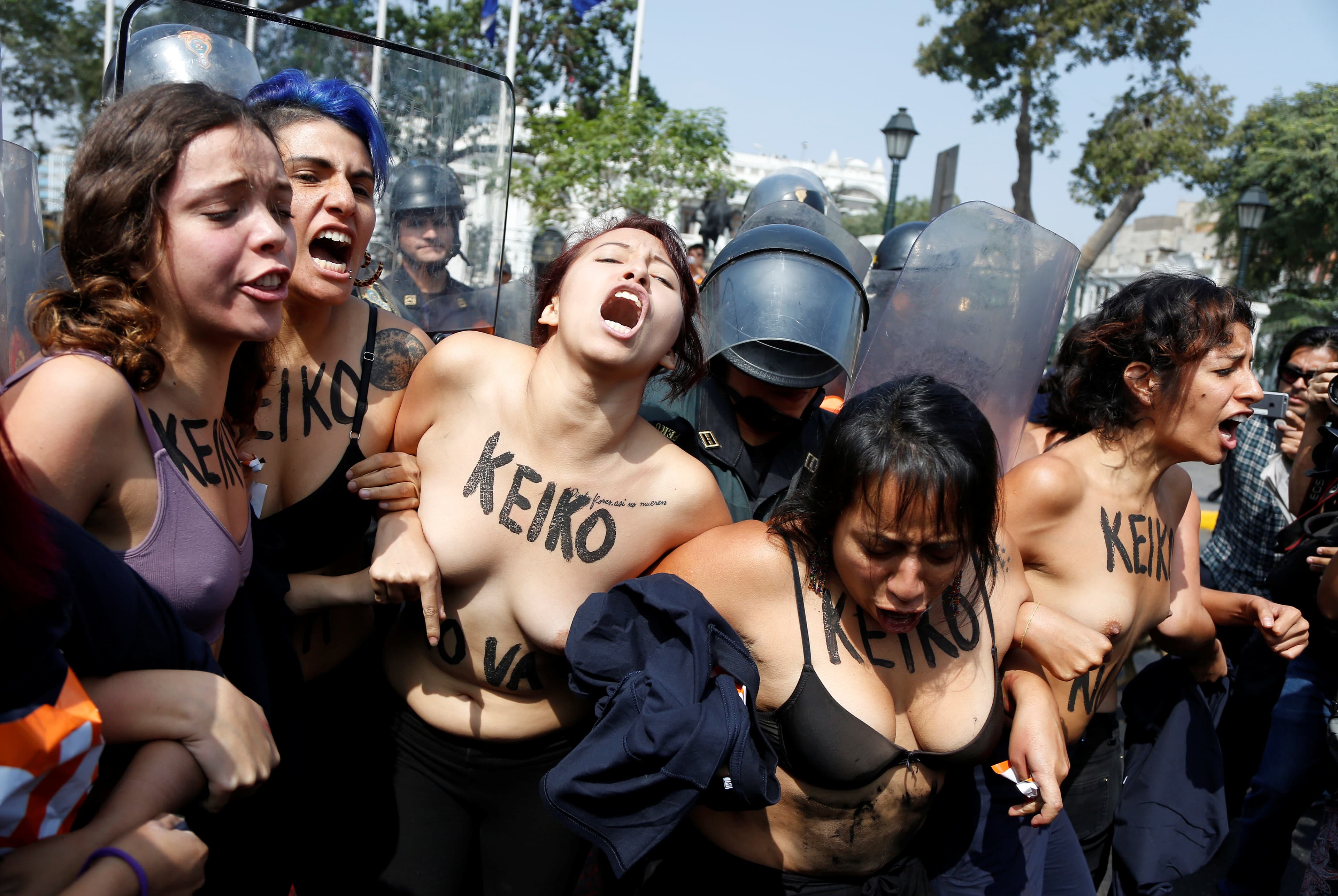 Activists seeking to legalize abortion protest against Peruvian presidential candidate Keiko Fujimori in front of the Congress in Lima, Peru, May 19, 2016. The text on the activists read: "No Keiko."