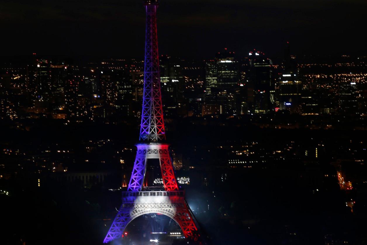 The Eiffel Tower is lit in the blue, white and red colors of the national flag at the end of a concert as part Bastille Day celebrations in Paris, France, on July 14.