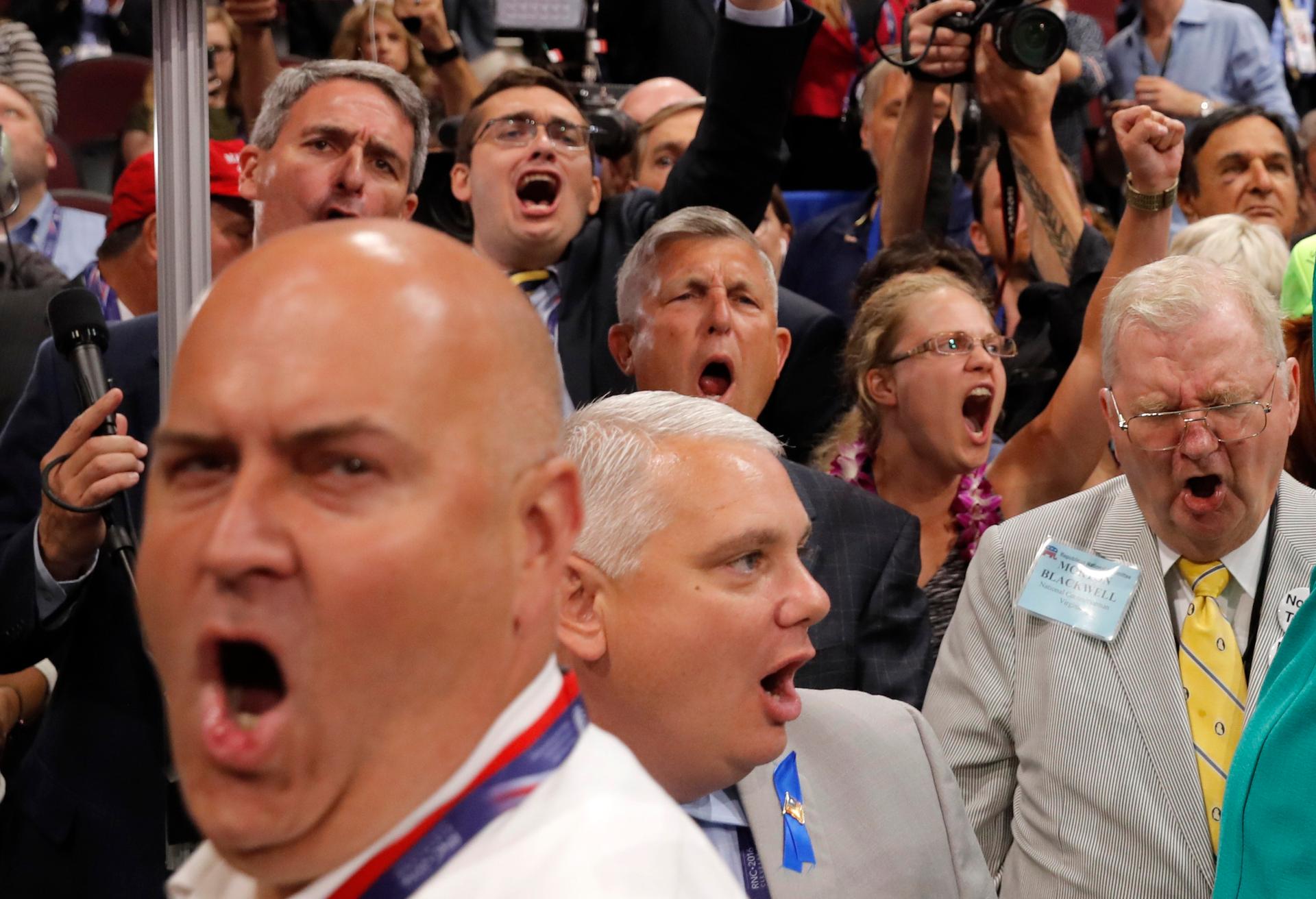 faces in crowd yelling, close up image