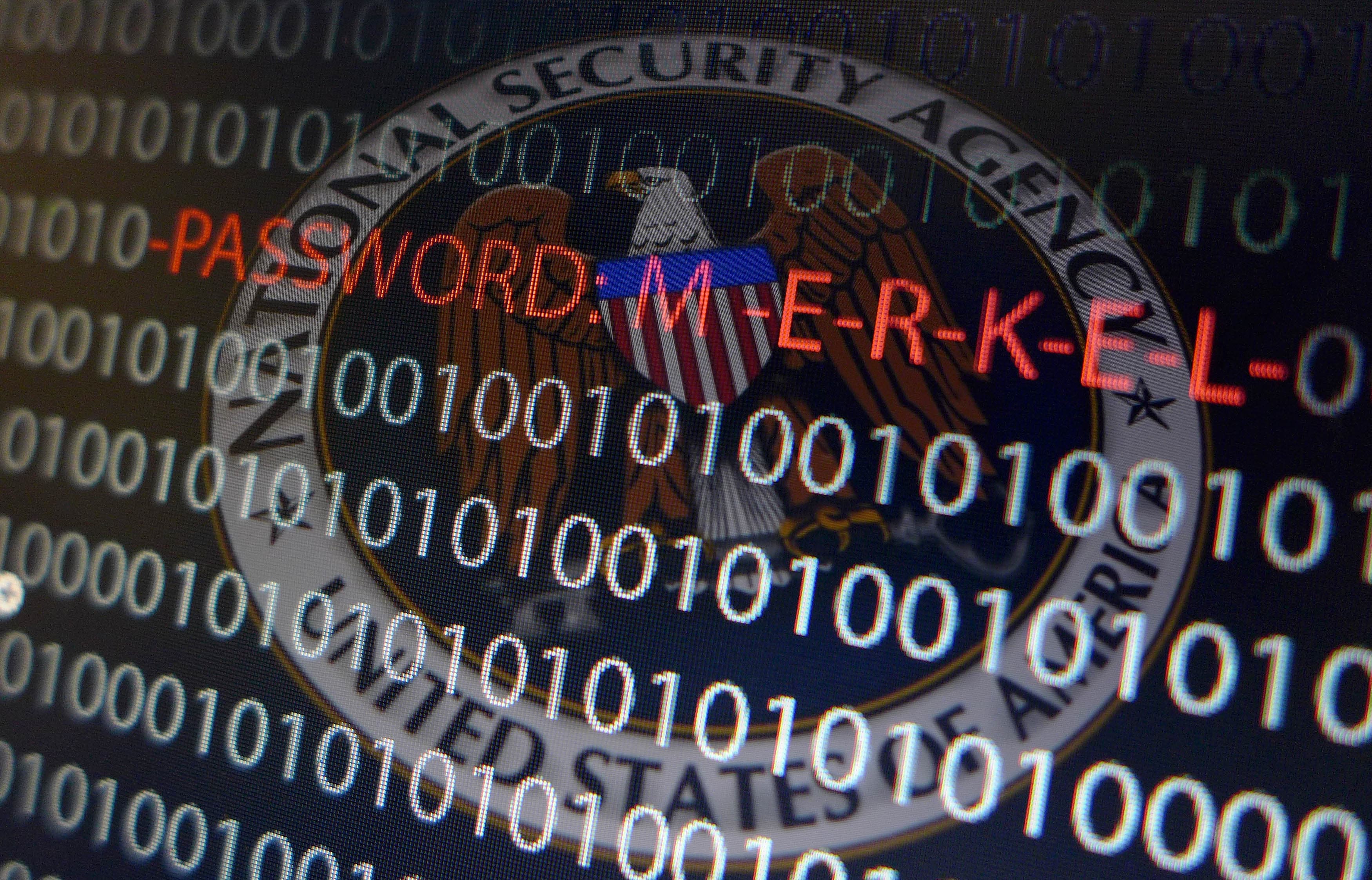 A computer with a series of numbers and the logo of the United States' National Security Agency (NSA)