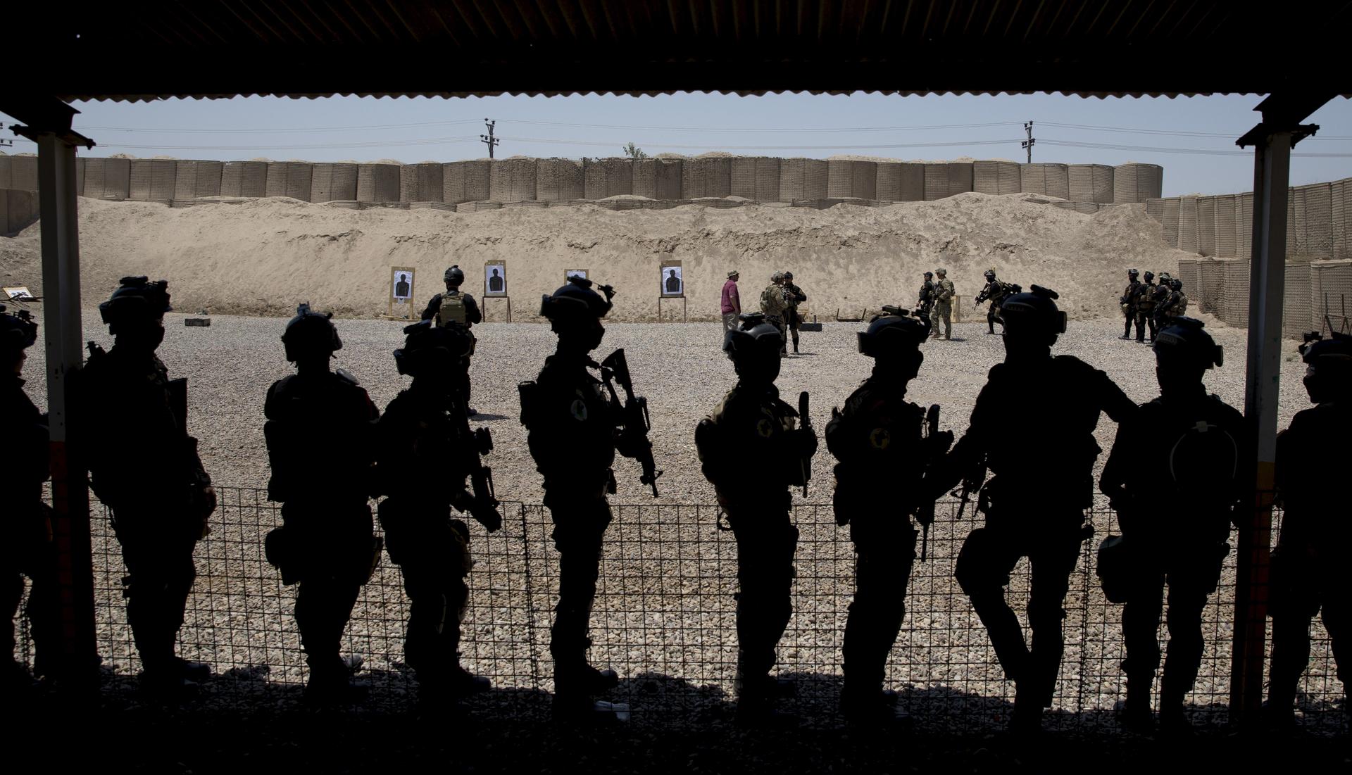 Members of the Iraqi military train at the Counter Terrorism Service training location, as observed by U.S. Defense Secretary Ash Carter in Baghdad, Iraq, Thursday, July 23, 2015.