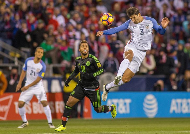 USA defender Omar Gonzalez (3) heads the ball over Mexico forward Giovani dos Santos (10) during a 2016 match at MAPFRE Stadium. Mexico beat the USA 2-1.