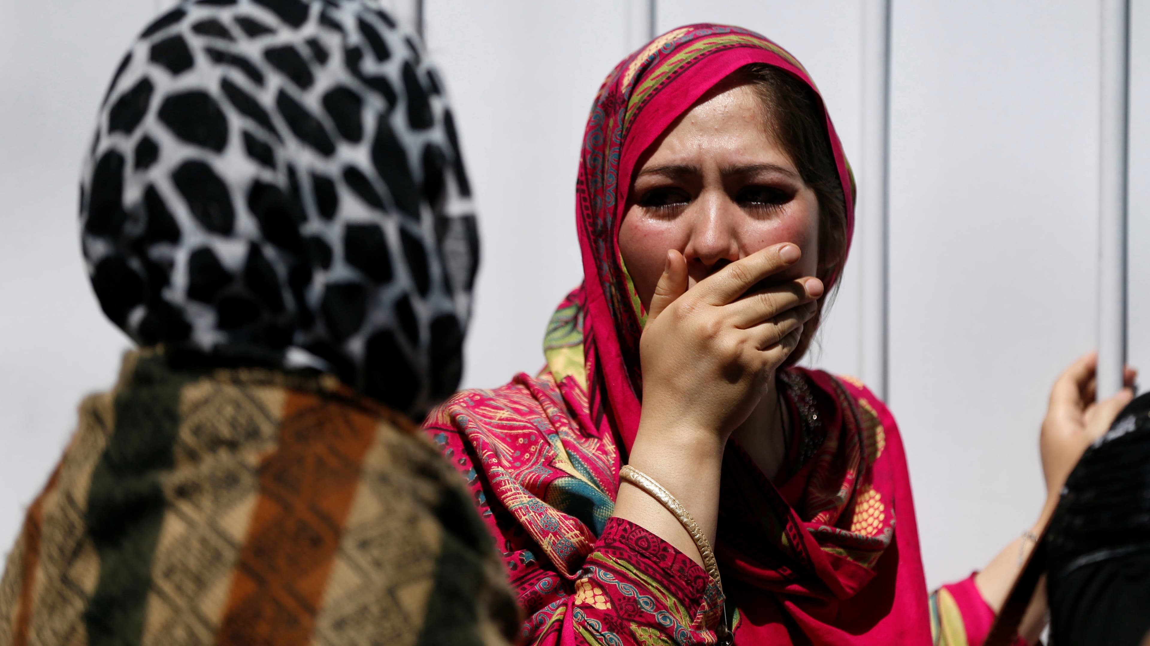 Relatives outside a hospital in Kabul mourn victims of the massive car bomb attack on May 31st 2017