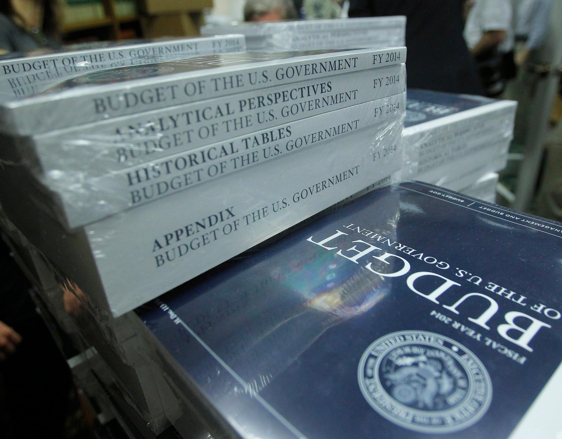 A federal budget book sits on a table.