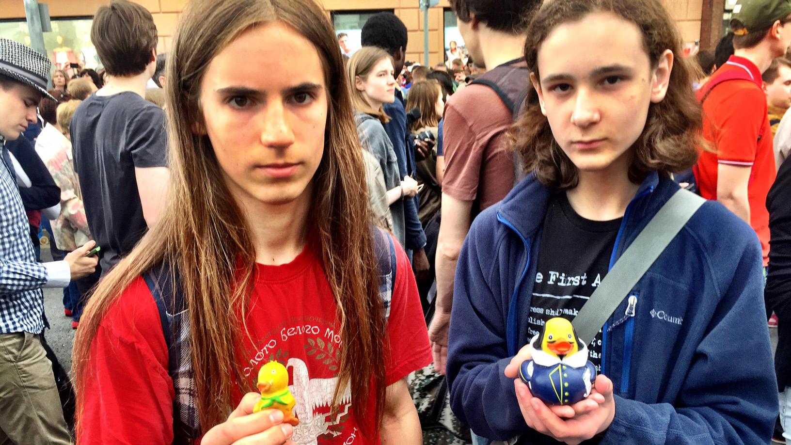Young protesters in Moscow holding up rubber ducks, which have become symbolic of corruption