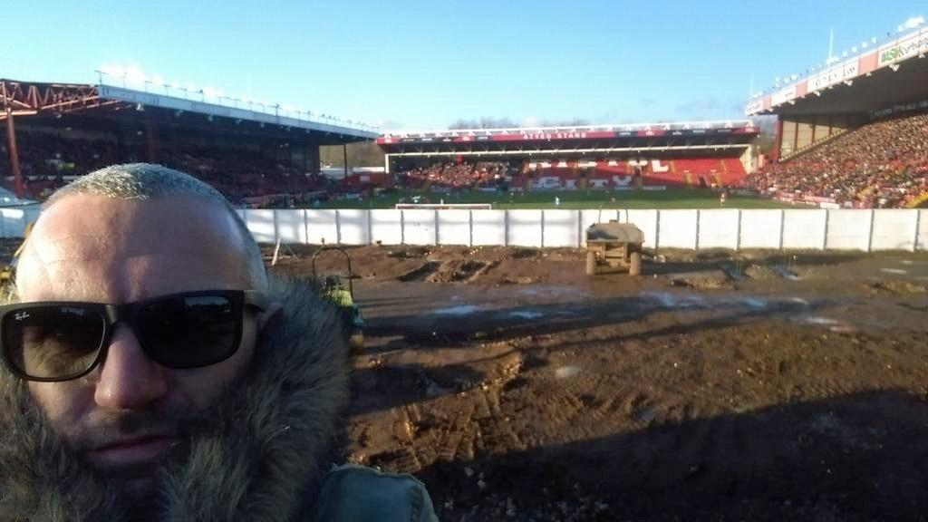 Ben Swift, commonly known as East End Shedman, poses from his viewing spot at the east end of Bristol's Ashton Gate stadium.