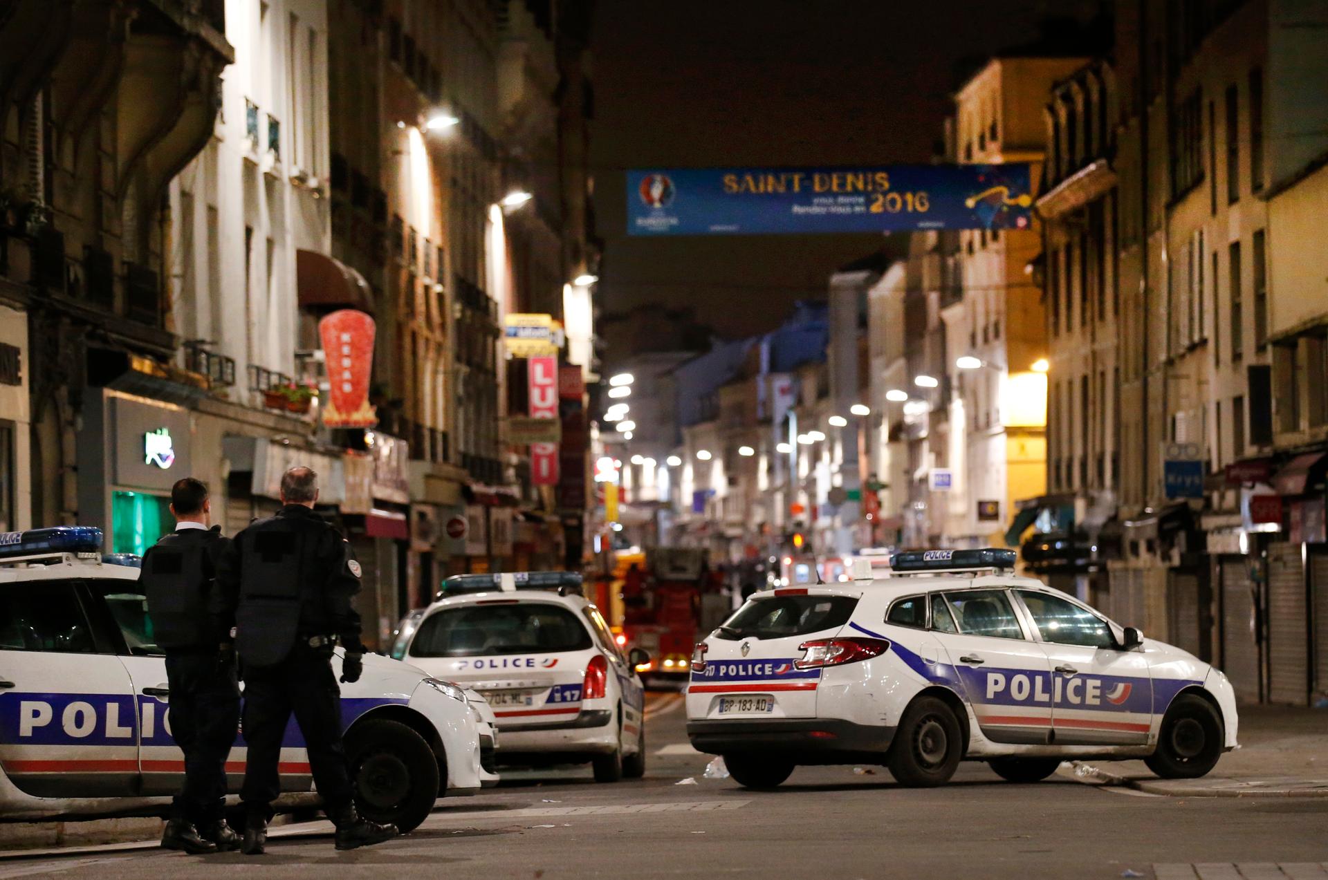 French police secure the area as shots are exchanged in Saint-Denis, France, near Paris, November 18, 2015 during an operation to catch fugitives from Friday night's deadly attacks in the French capital.