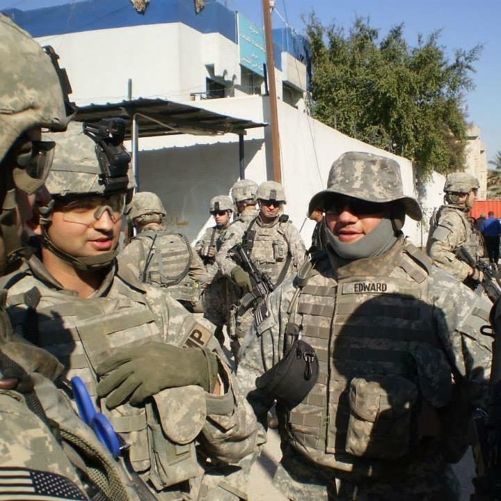Wisam Albaiedhani (left) interpreting for US troops in Iraq.